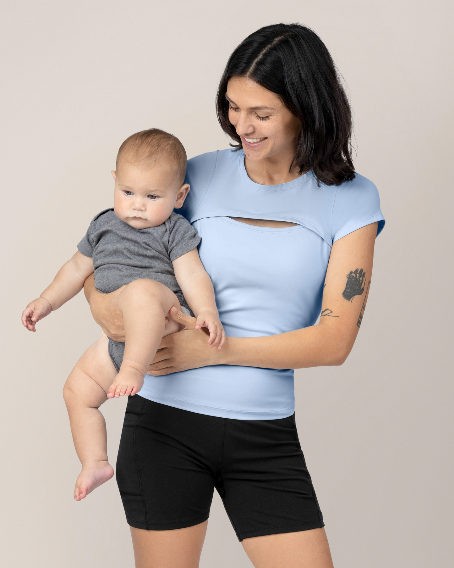 Front view of model wearing the Luna Active Cut Out Nursing Top in French Blue
