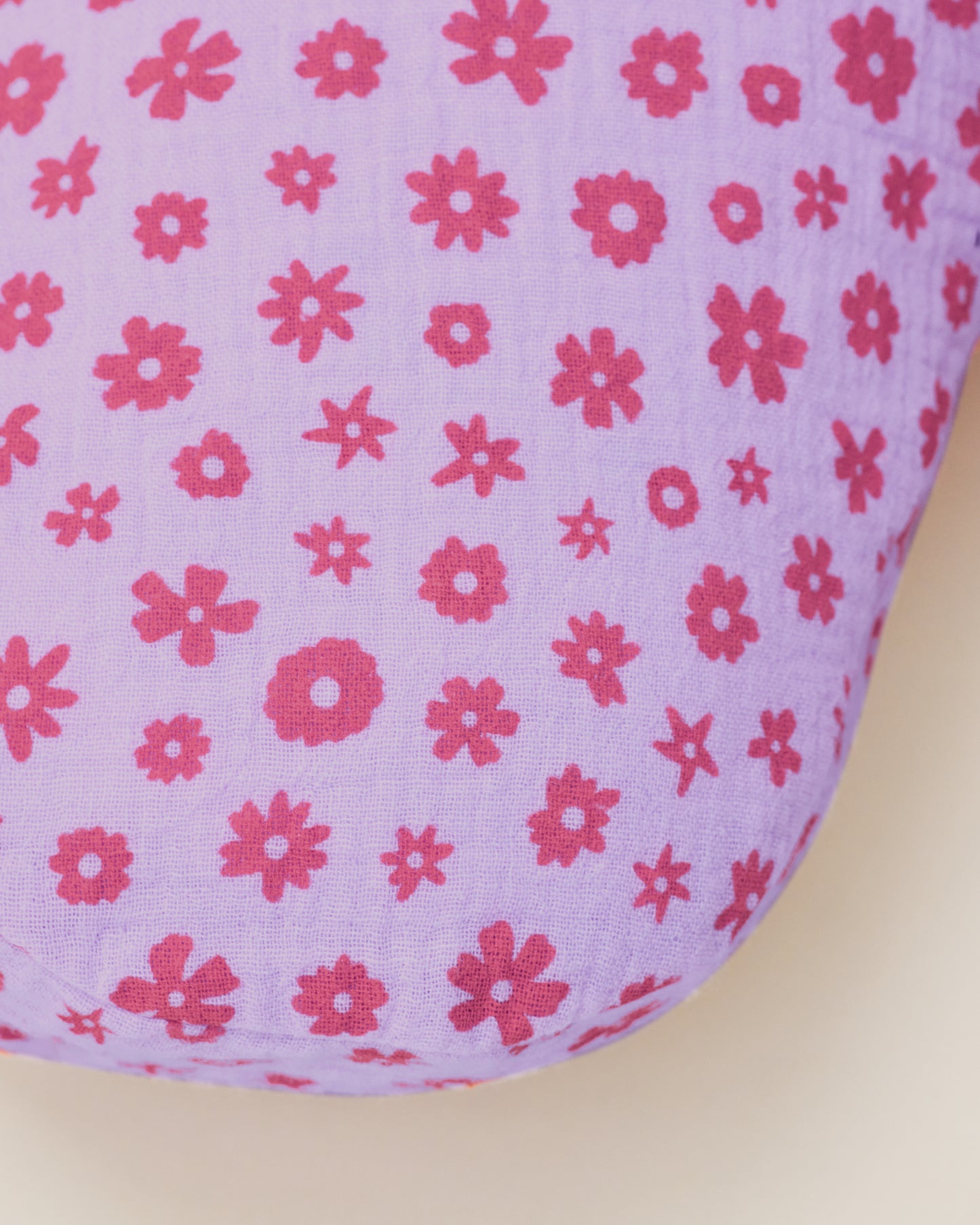 Close up of the Organic Muslin Nursing Pillow Cover in the Lavender Cosmos print