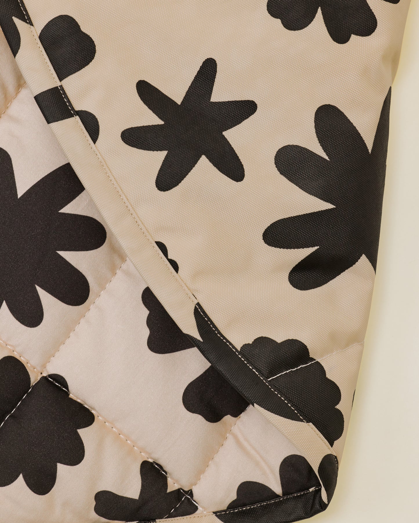 Close up of the Inside/Outside Play Mat in Cream Chamomiles print.