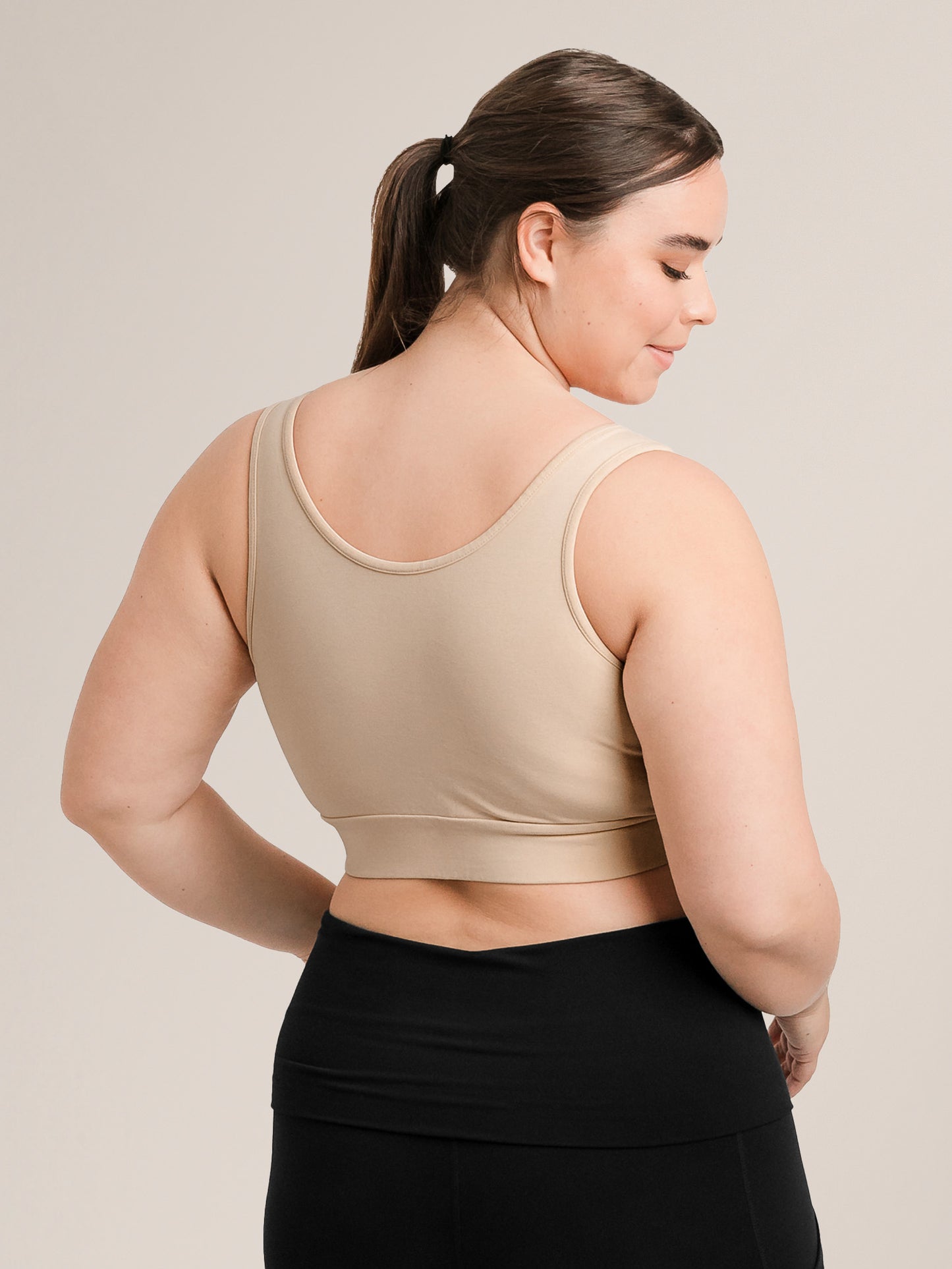 Back view of model wearing the Organic Cotton Sleep & Nursing Bra in Beige