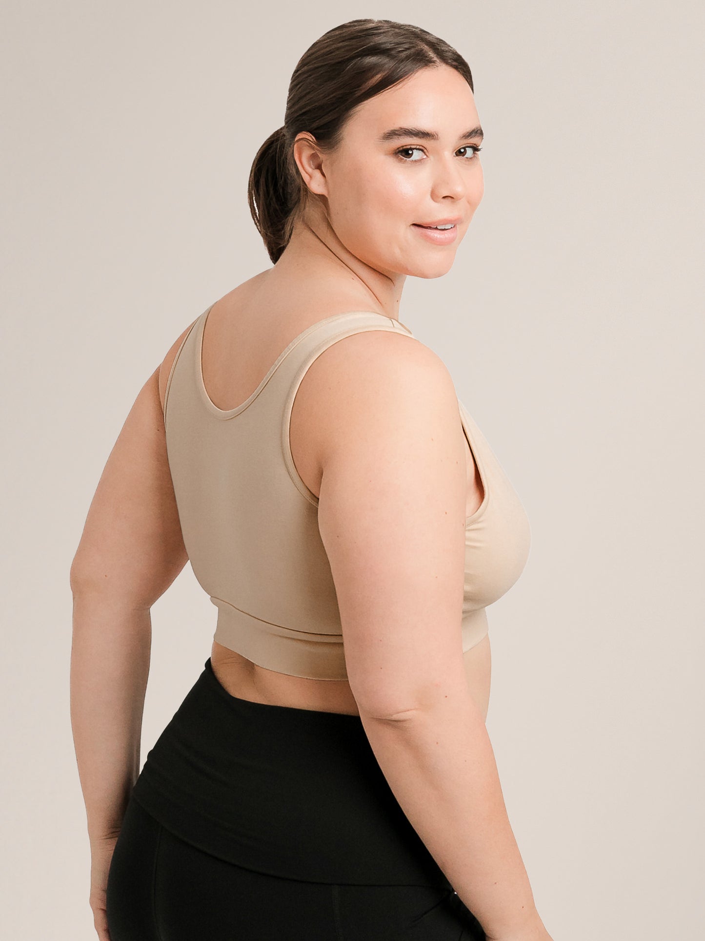 Side & back view of model wearing the Model wearing the Organic Cotton Sleep & Nursing Bra in Beige