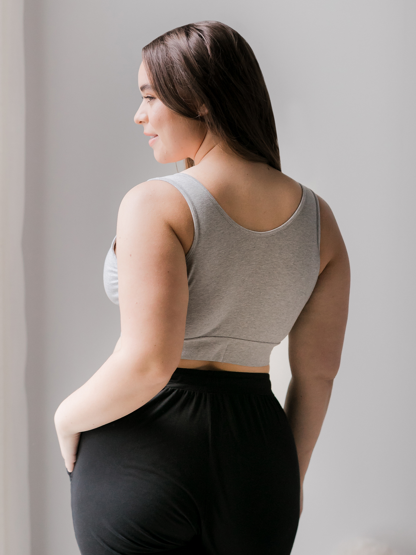 Back view of model wearing the Organic Cotton Sleep & Nursing Bra in Grey Heather