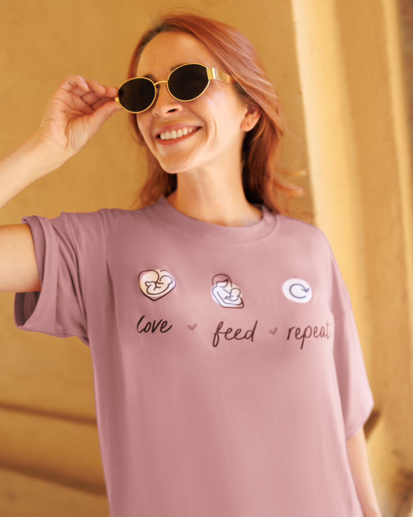Close up of model wearing Oversized Graphic Tee in Love Feed Repeat, focused on t-shirt design @model_info:Shannon is wearing a Small.