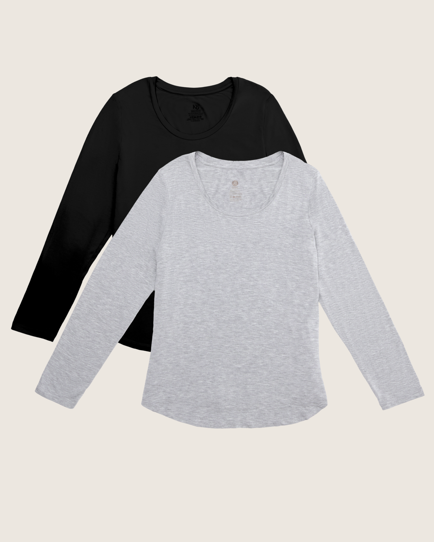 Black and gray long-sleeve shirts on a beige background