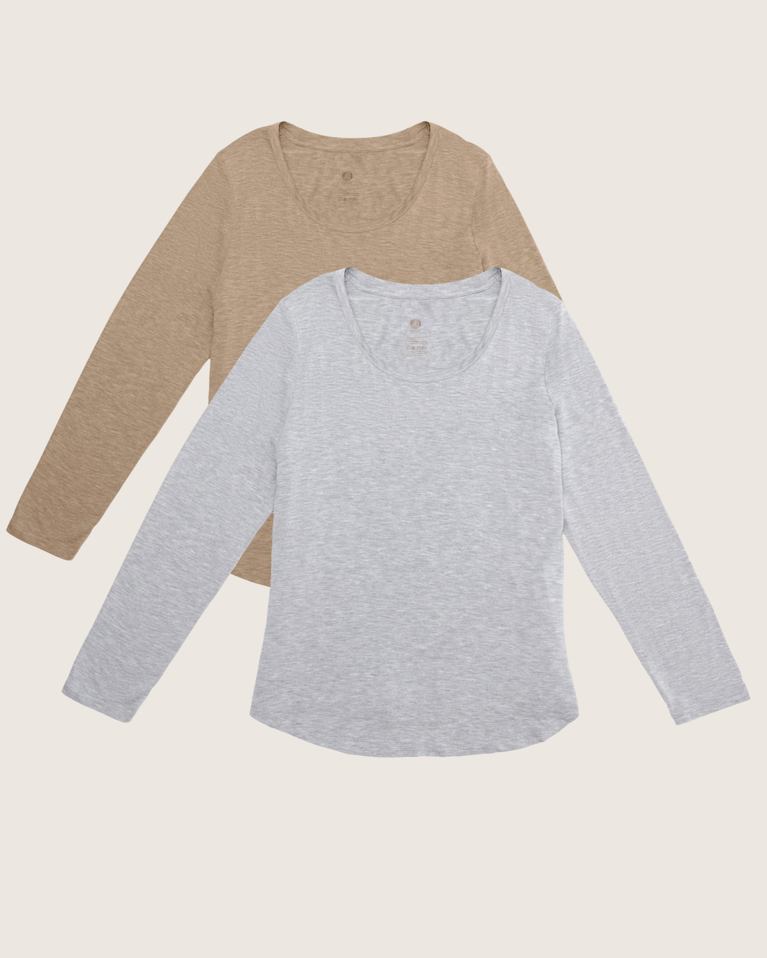 Two long-sleeve shirts, one brown and one gray, on a light beige background.