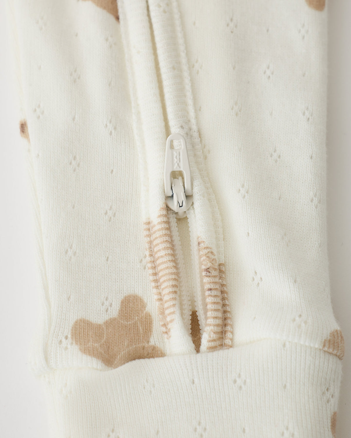 Close up of pant detail on Pointelle Baby Pajama in Ivory Bears on an off white background.