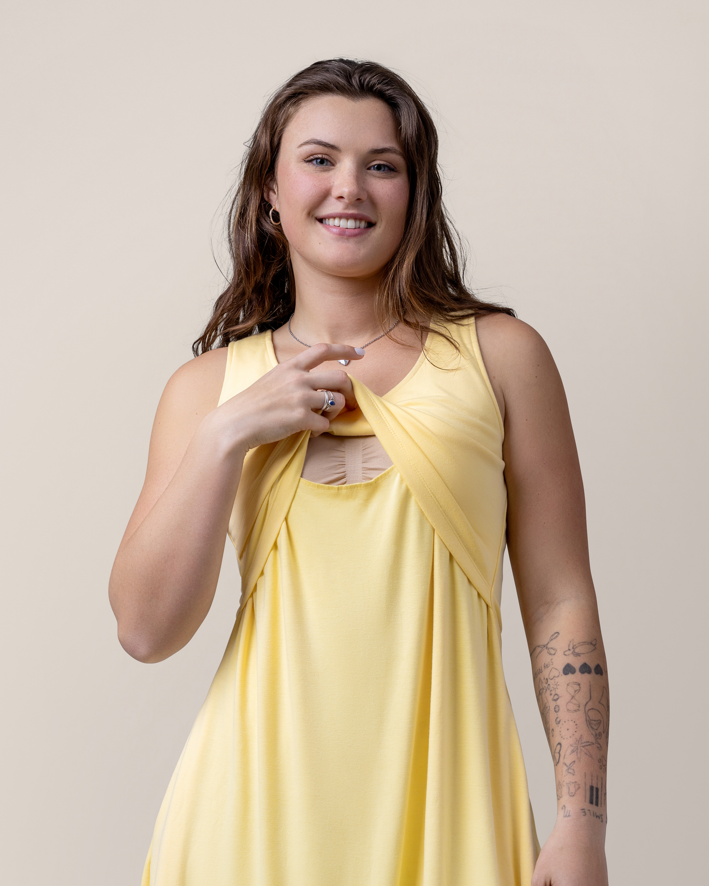 Front view of model showing nursing access on the Penelope Crossover Nursing Dress in Butter Yellow