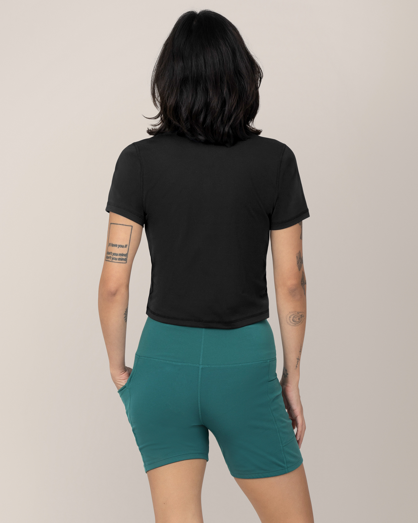 Back view of model wearing the Stevie Active Postpartum Bike Short in Teal with the Presley Active Zip Front Nursing Top