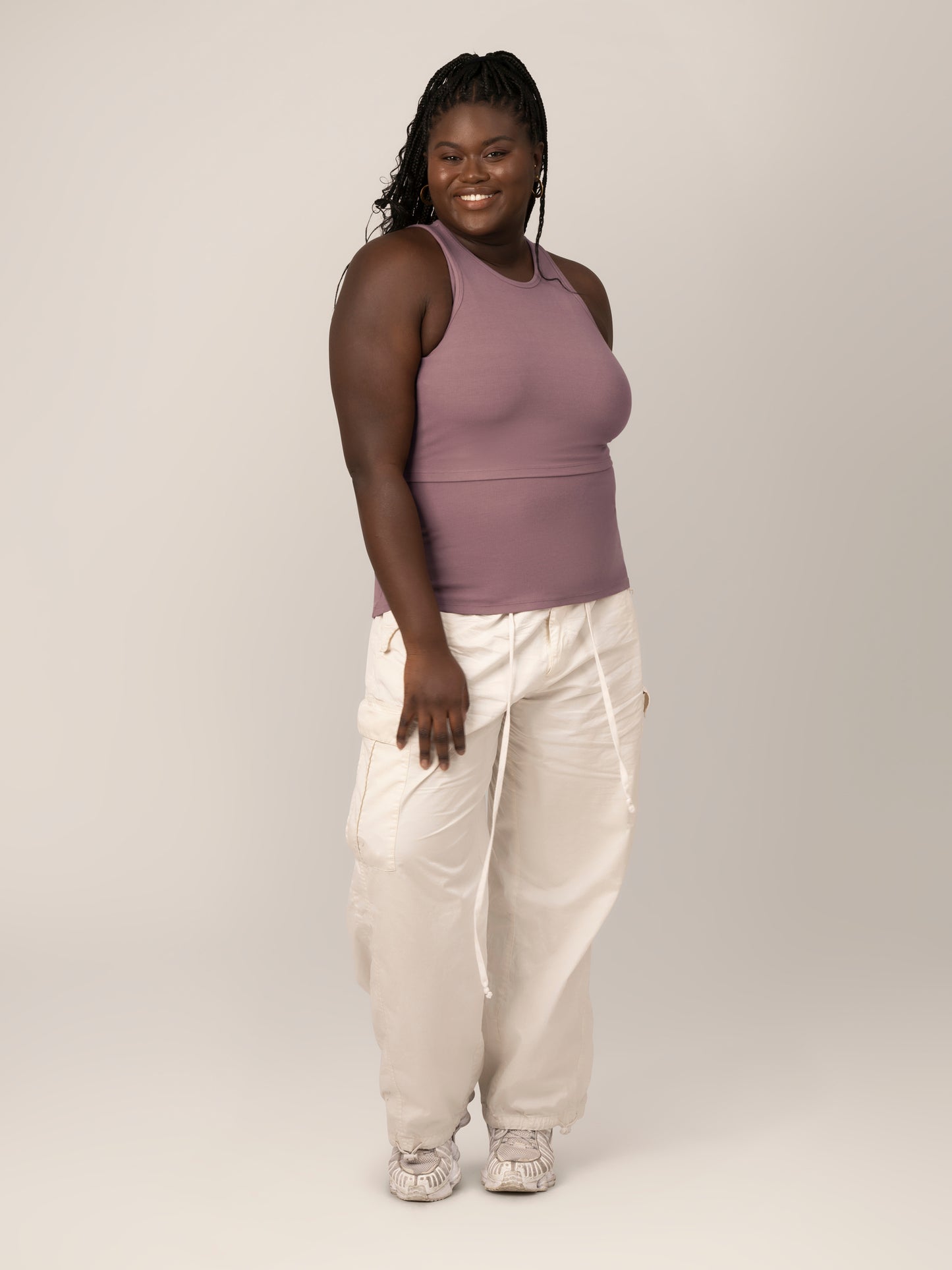 Full body view of model wearing the Ribbed Bamboo Racerback Nursing Tank in Twilight, paired with white cargo pants and tennis shoes