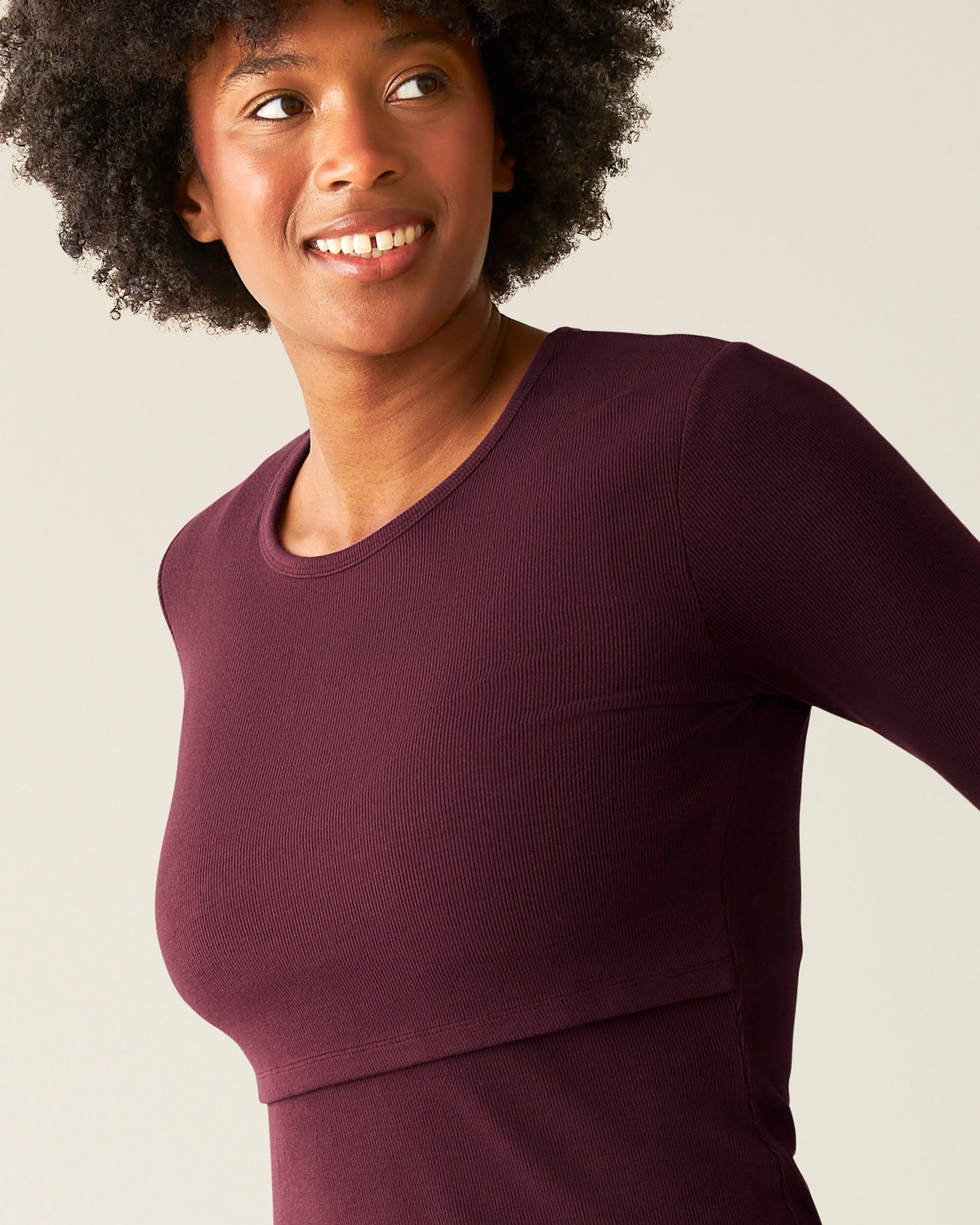 Close-up of woman wearing the Ribbed Bamboo Long Sleeve Nursing T-shirt in Deep Burgundy