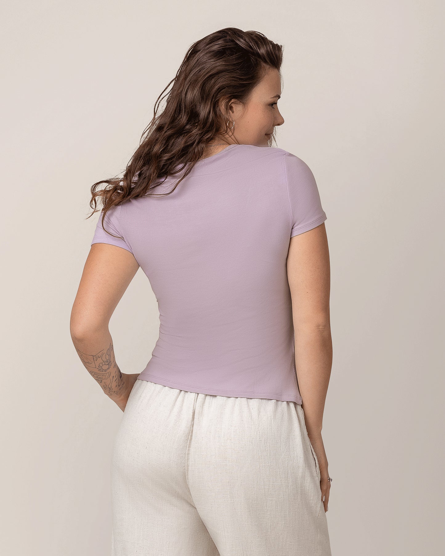 Back view of model wearing Ribbed Bamboo Crew Neck Nursing T-shirt in Lavender Mist
