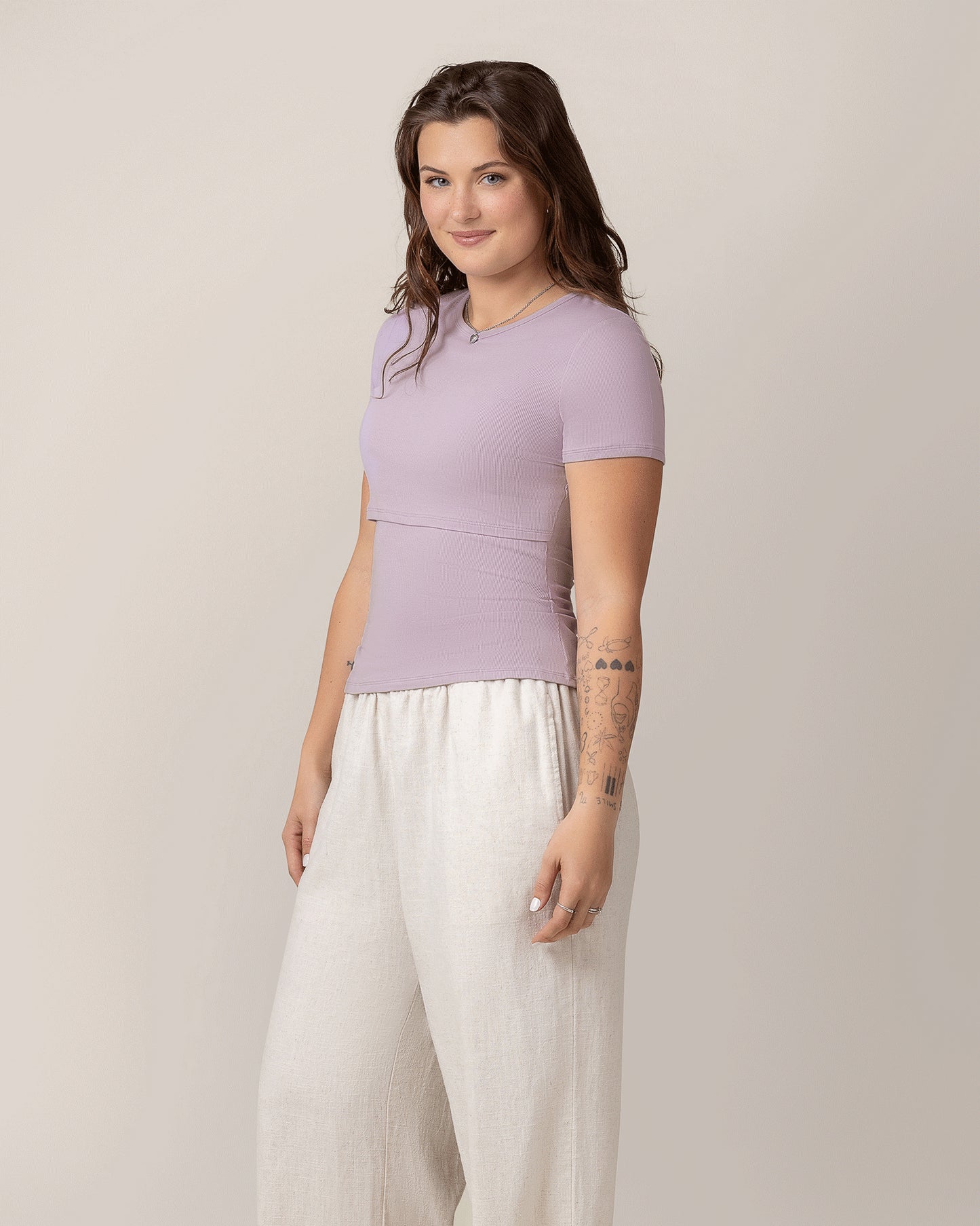 Side view of model wearing Ribbed Bamboo Crew Neck Nursing T-shirt in Lavender Mist