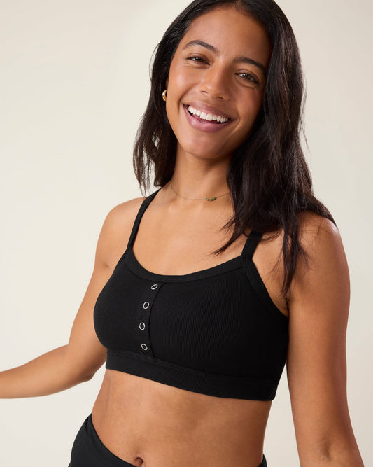 Woman wearing the Ribbed Bamboo Pumping Bralette in Black@model_info:Nemesis is wearing a Medium.
