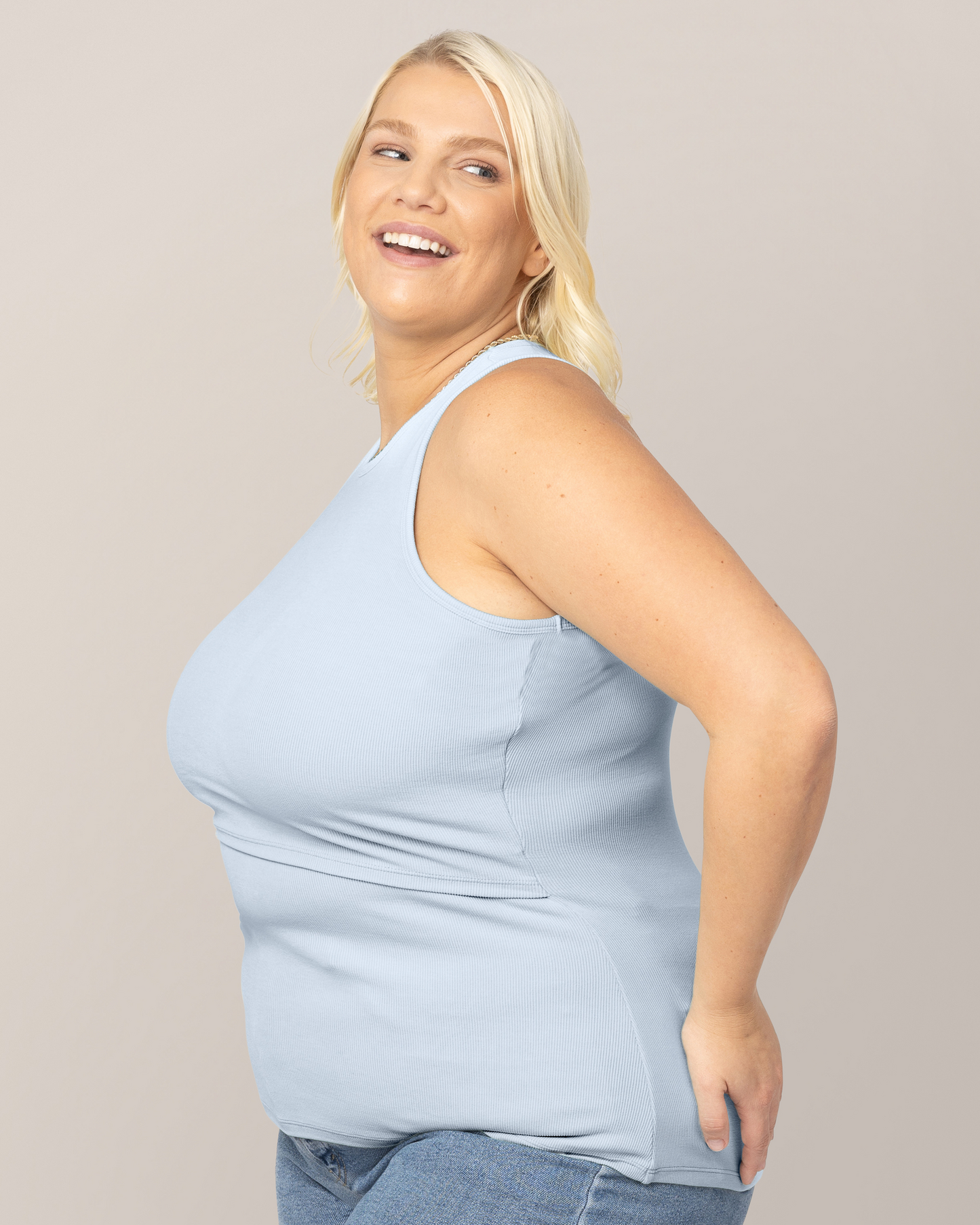 Side view of model wearing the Ribbed Bamboo Racerback Nursing Tank in French Blue