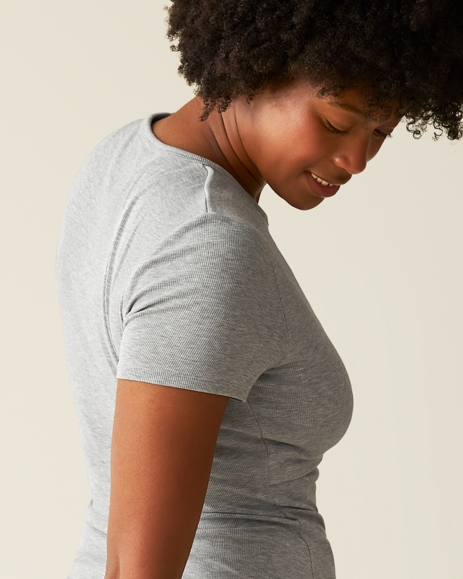 Side view of model wearing Ribbed Bamboo Crew Neck Nursing T-shirt in Grey Heather