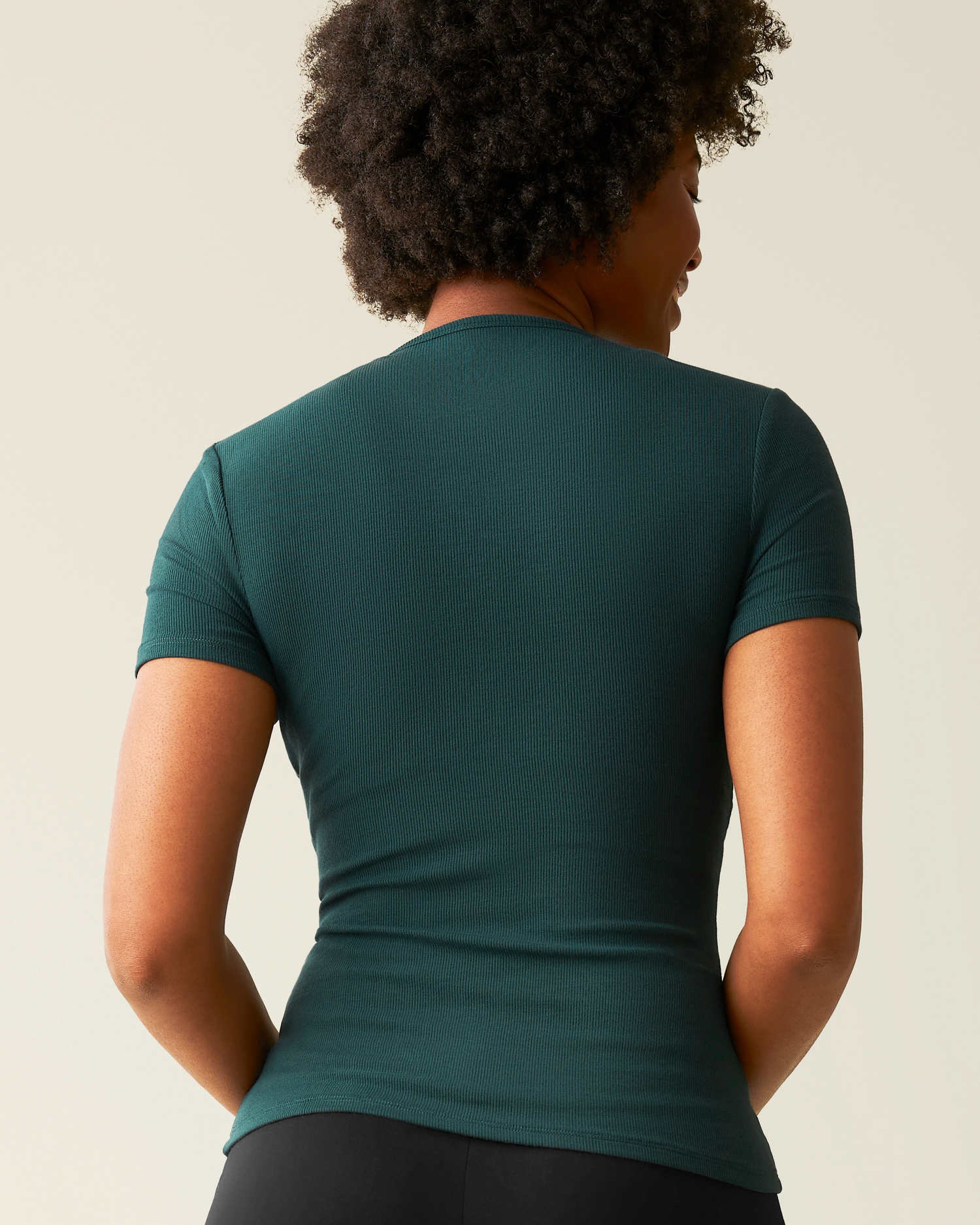 Back view of model wearing Ribbed Bamboo Crew Neck Nursing T-shirt in Evergreen