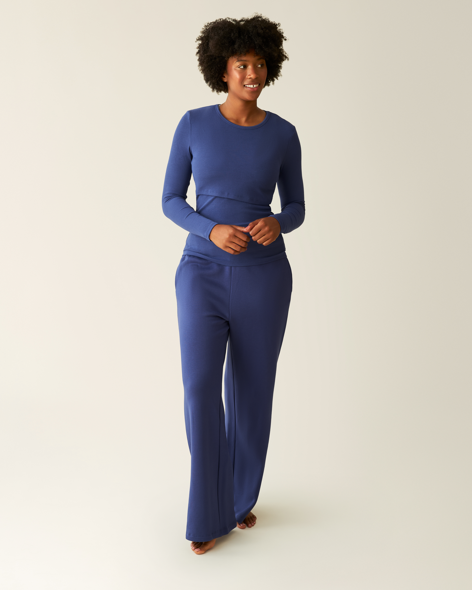 Woman wearing the Ribbed Bamboo Long Sleeve Nursing T-shirt with matching Cloud Fleece Sweatpant in Deep Blue@model_info:Kyra is 5'9" and wearing a Small.