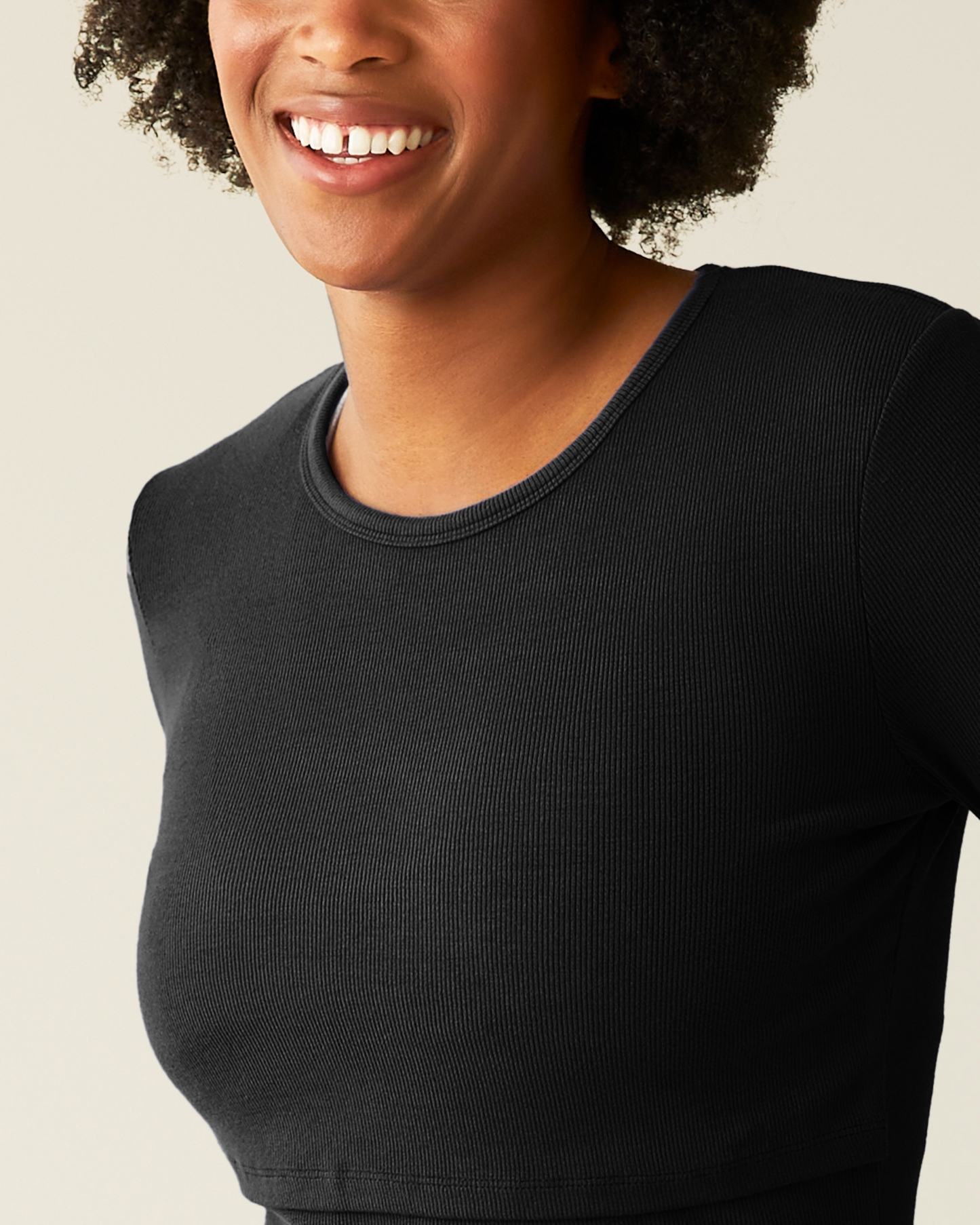 Close-up of woman wearing the Ribbed Bamboo Long Sleeve Nursing T-shirt in Black