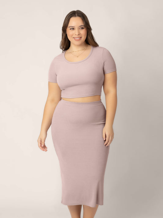 Front view of model wearing the Ribbed Bamboo Maternity & Postpartum Midi Skirt in lilac stone, paired with the crop top from the Olivia 2-in-1 Dress @model_info:Venezia is wearing a Large.