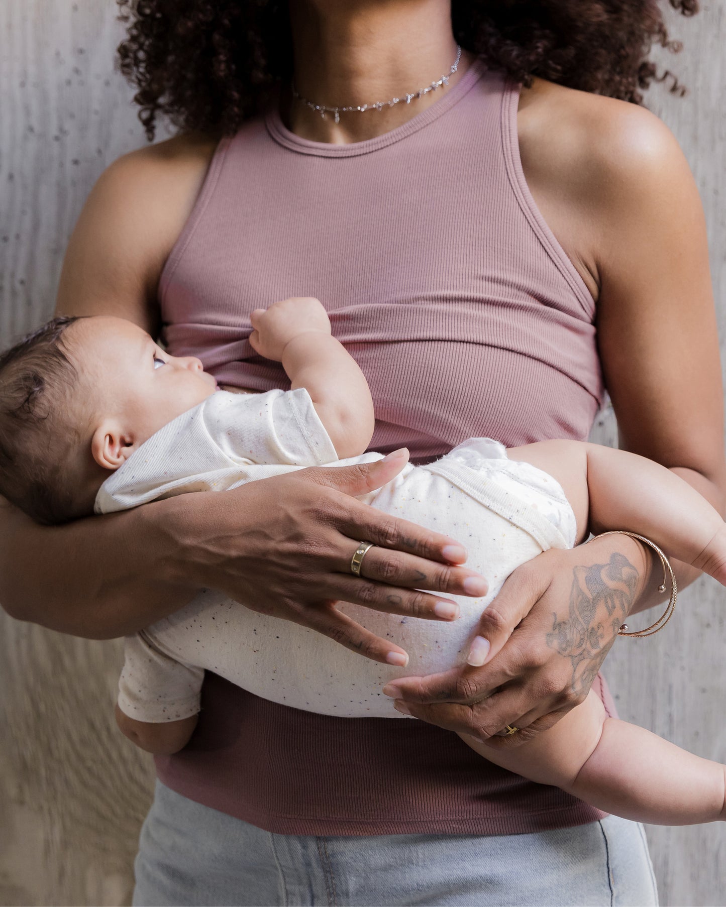 Model wearing the Ribbed Bamboo Racerback Nursing Tank in Twilight@model_info:Rudi is wearing a Small.