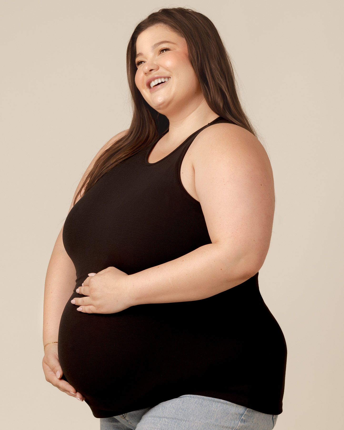 Side view of model wearing the Bamboo Racerback Nursing Tank in Black