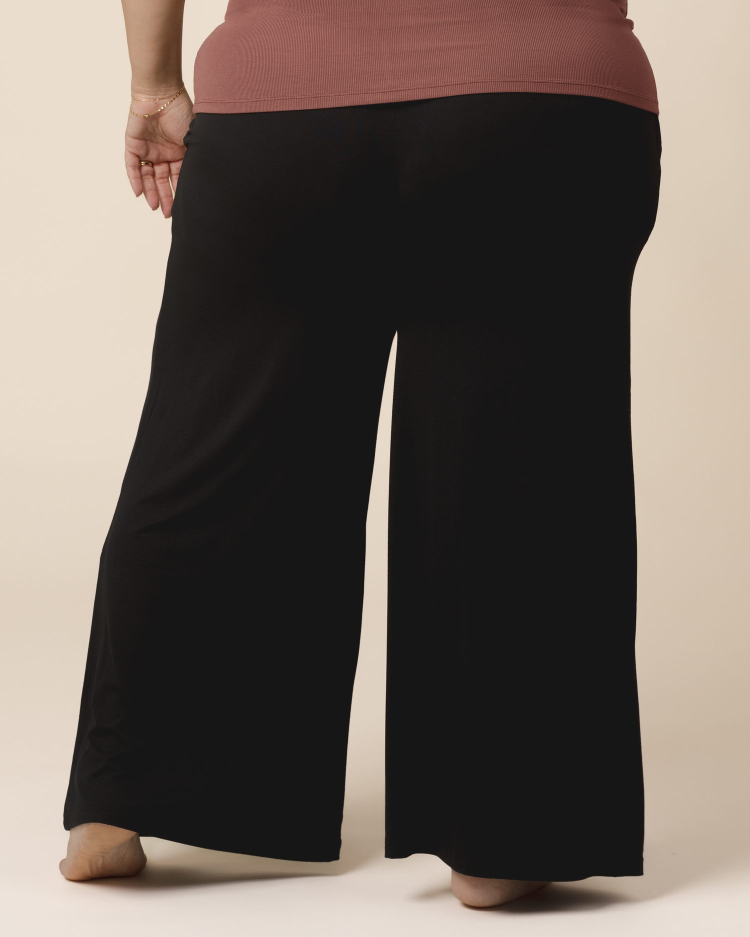 Cropped in back view of model wearing the Bamboo Wide Leg Maternity & Postpartum Lounge Pant in Black.