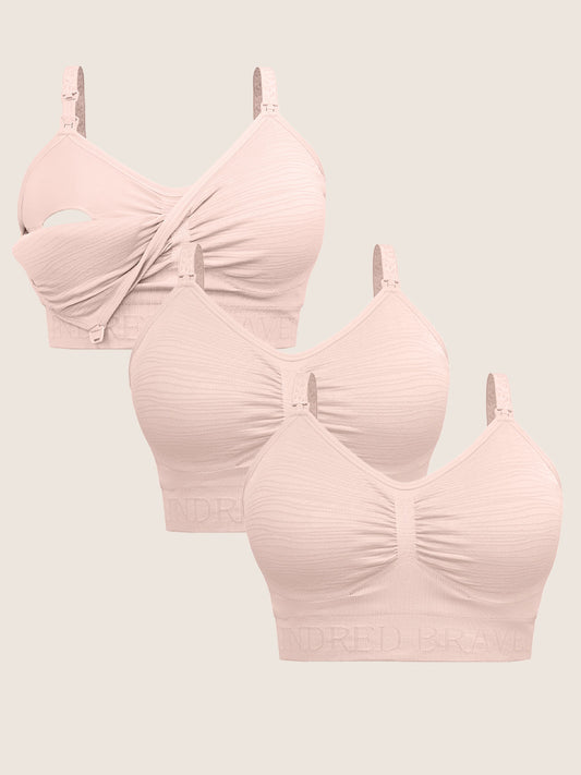 A Wash Wear Spare® Pumping Bra Pack in Pink Heather showing three Sublime® Hands-Free Pumping & Nursing Brain pink heather against a beige background
