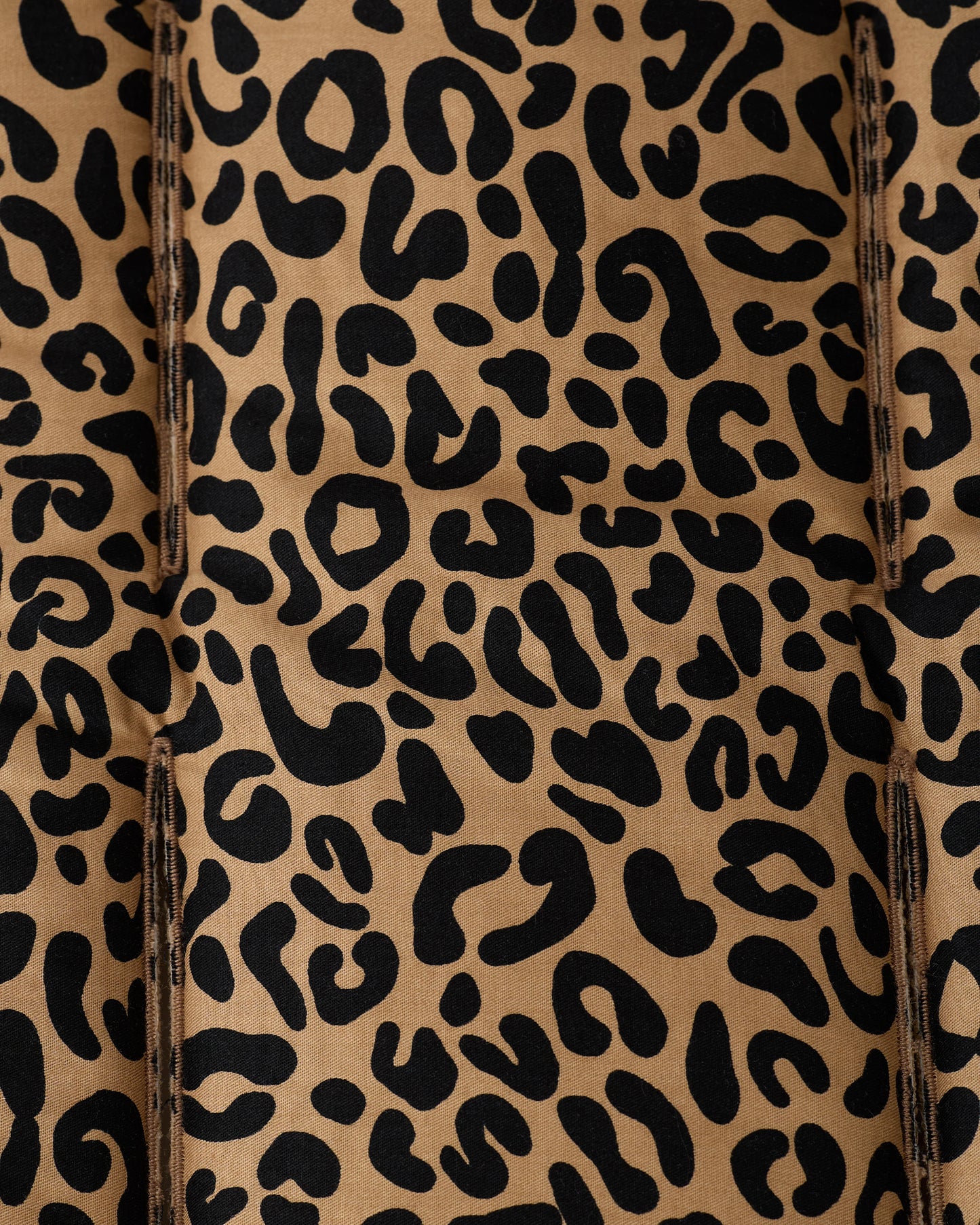 Close up of leopard pattern on the Stroller Party™ Seat Liner.