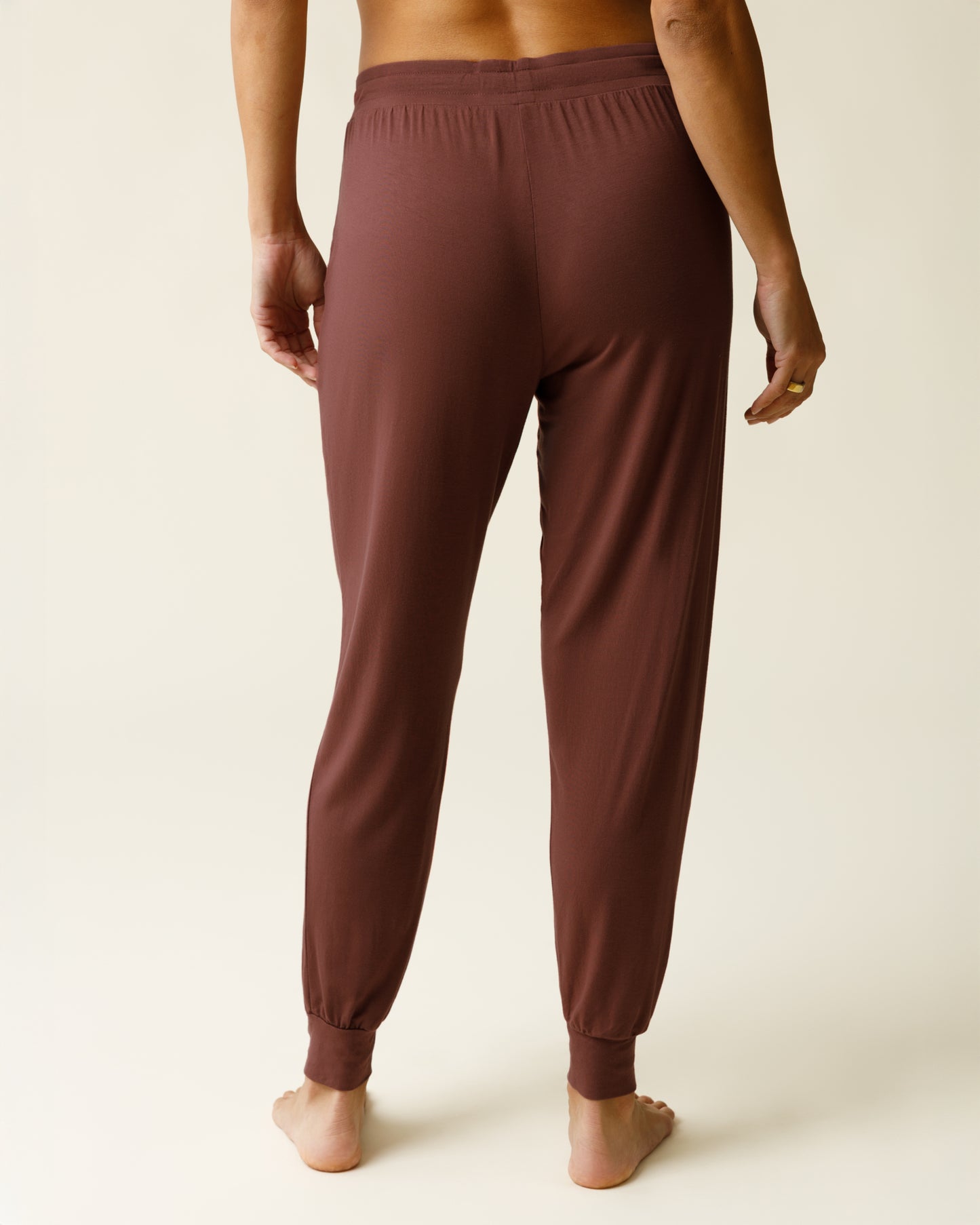 Woman wearing the Everyday Lounge Jogger in Redwood, showing back