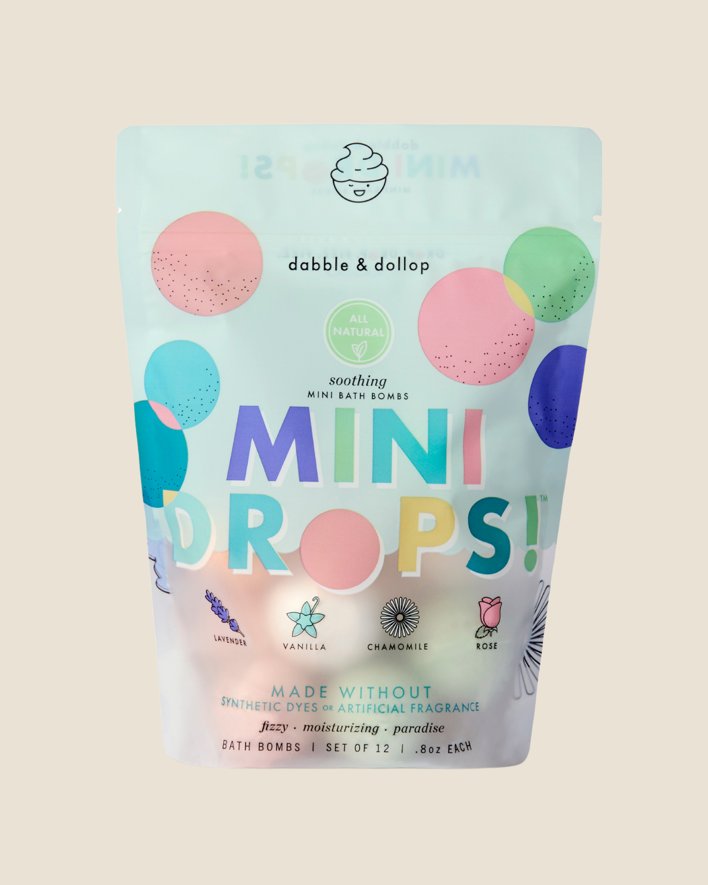 Package of dabble & dollop soothing mini bath bombs on a beige background