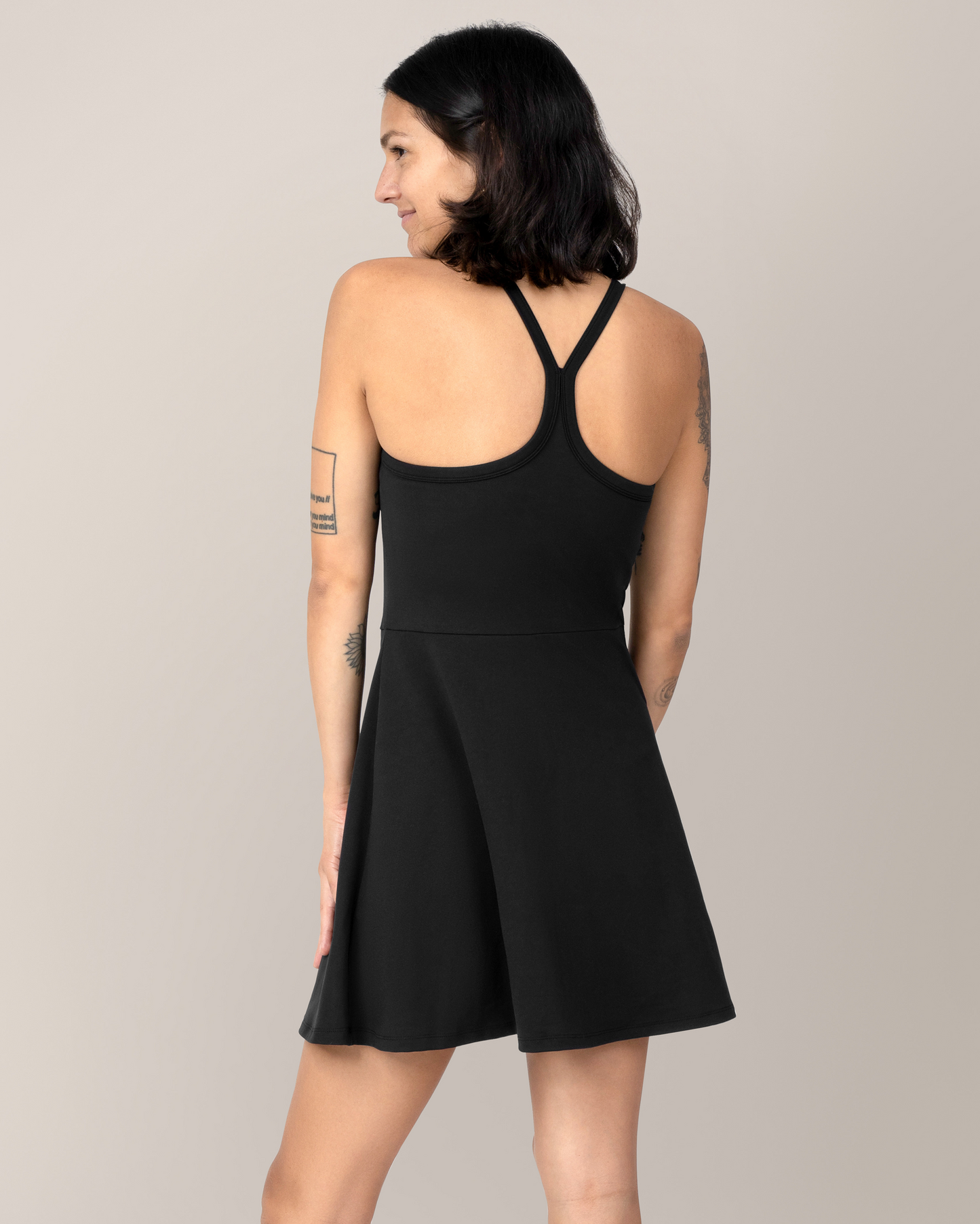 Back view of model wearing the Stevie Active Racerback Nursing Dress in Black