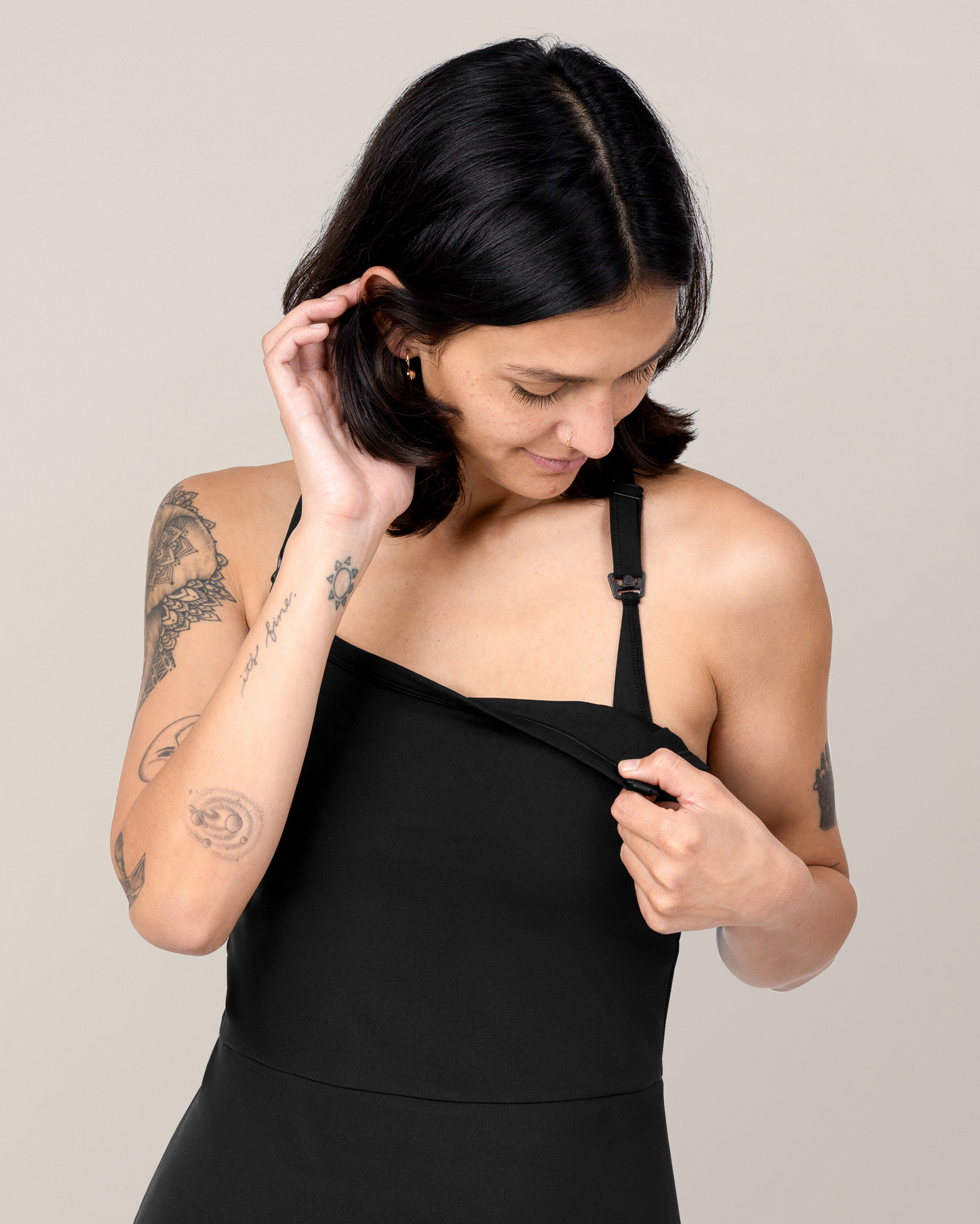 Front view of model wearing the Stevie Active Racerback Nursing Dress in Black showing nursing clip down access