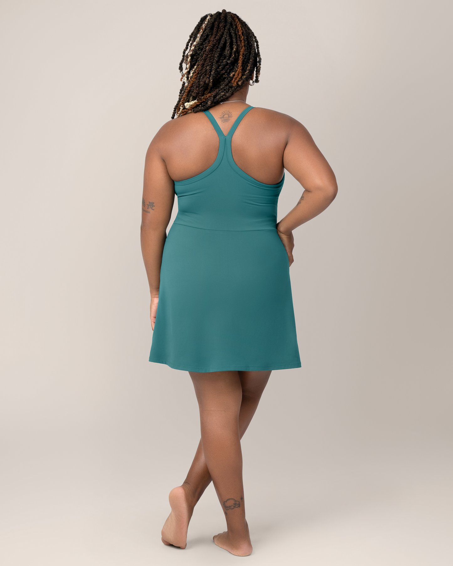 Back view of model wearing the Stevie Active Racerback Nursing Dress in Teal