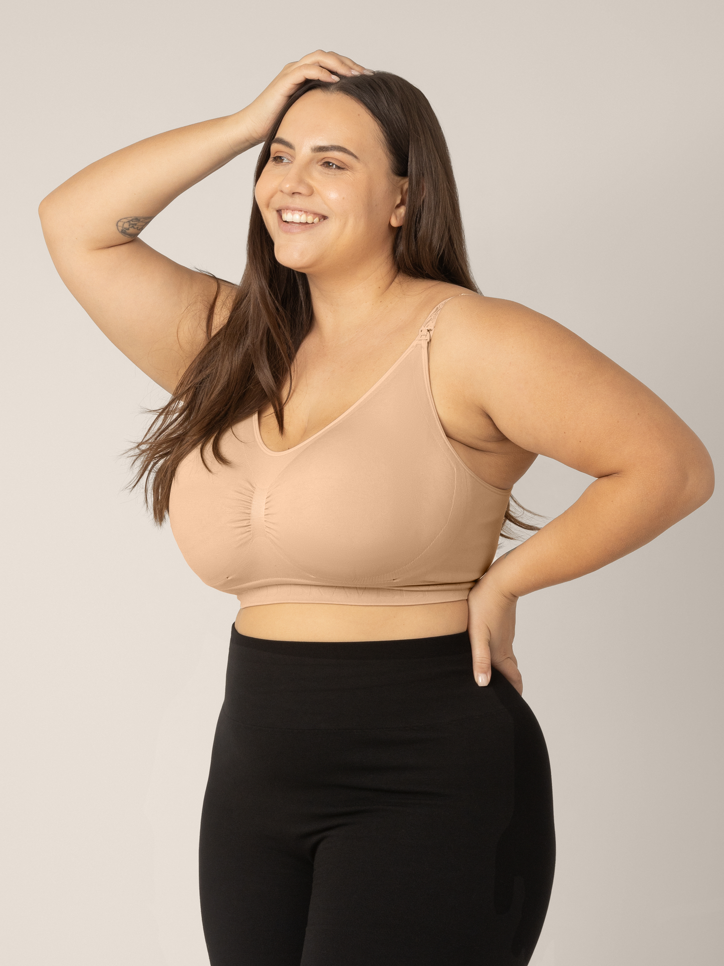 Side view of model wearing the Sublime Nursing Bra in beige showing the Super-busty size range.@model_info:Anna is wearing an X-Large Super Busty.