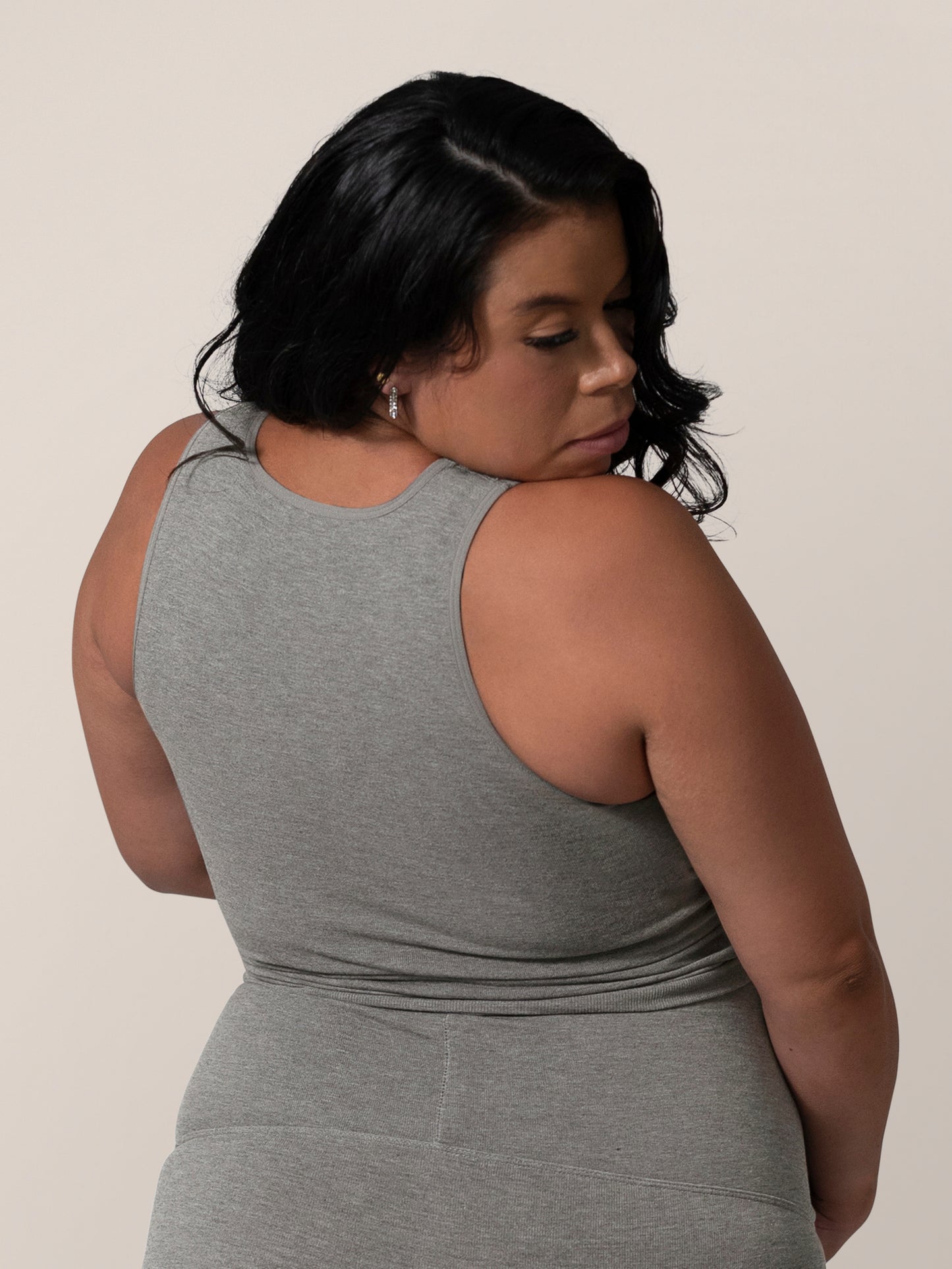 3/4 back view of model wearing the Sublime® Bamboo Maternity & Nursing Longline Bra in Charcoal