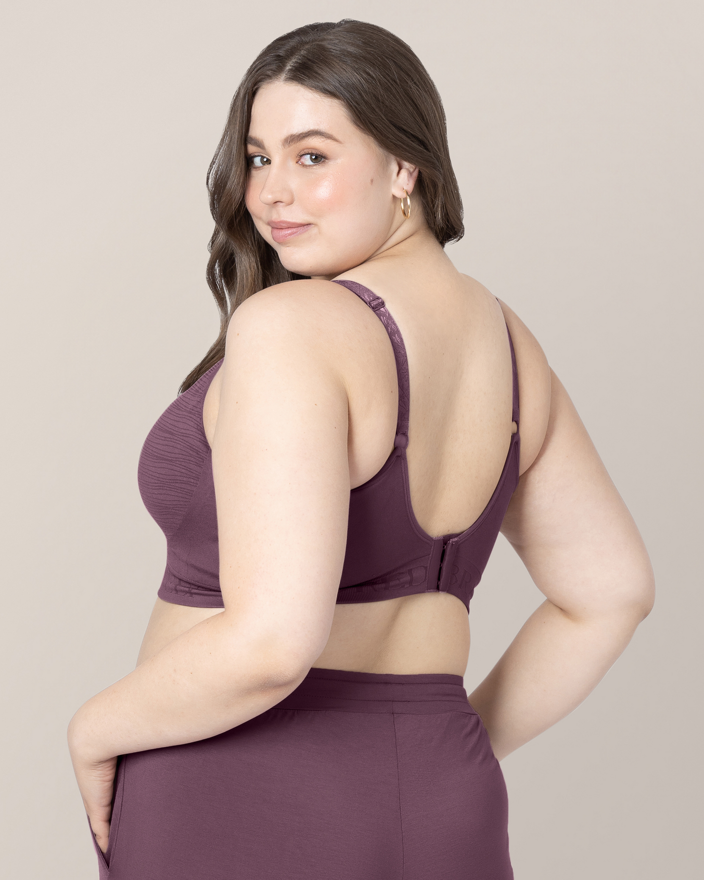 3/4 back view of model wearing the Sublime® Hands-Free Pumping & Nursing Bra in Burgundy Plum