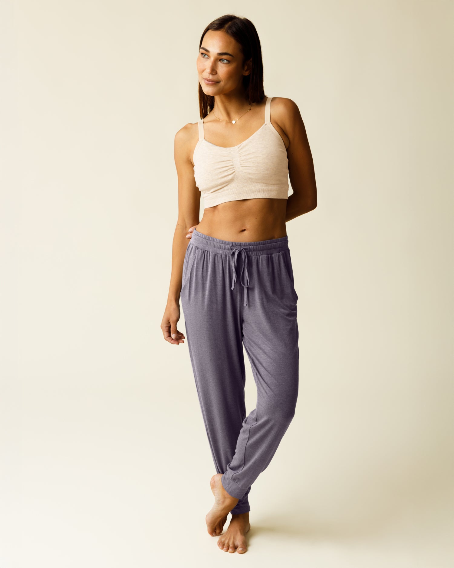 Woman wearing the Everyday Lounge Jogger in Heathered Granite, paired with Oatmeal Heather bra