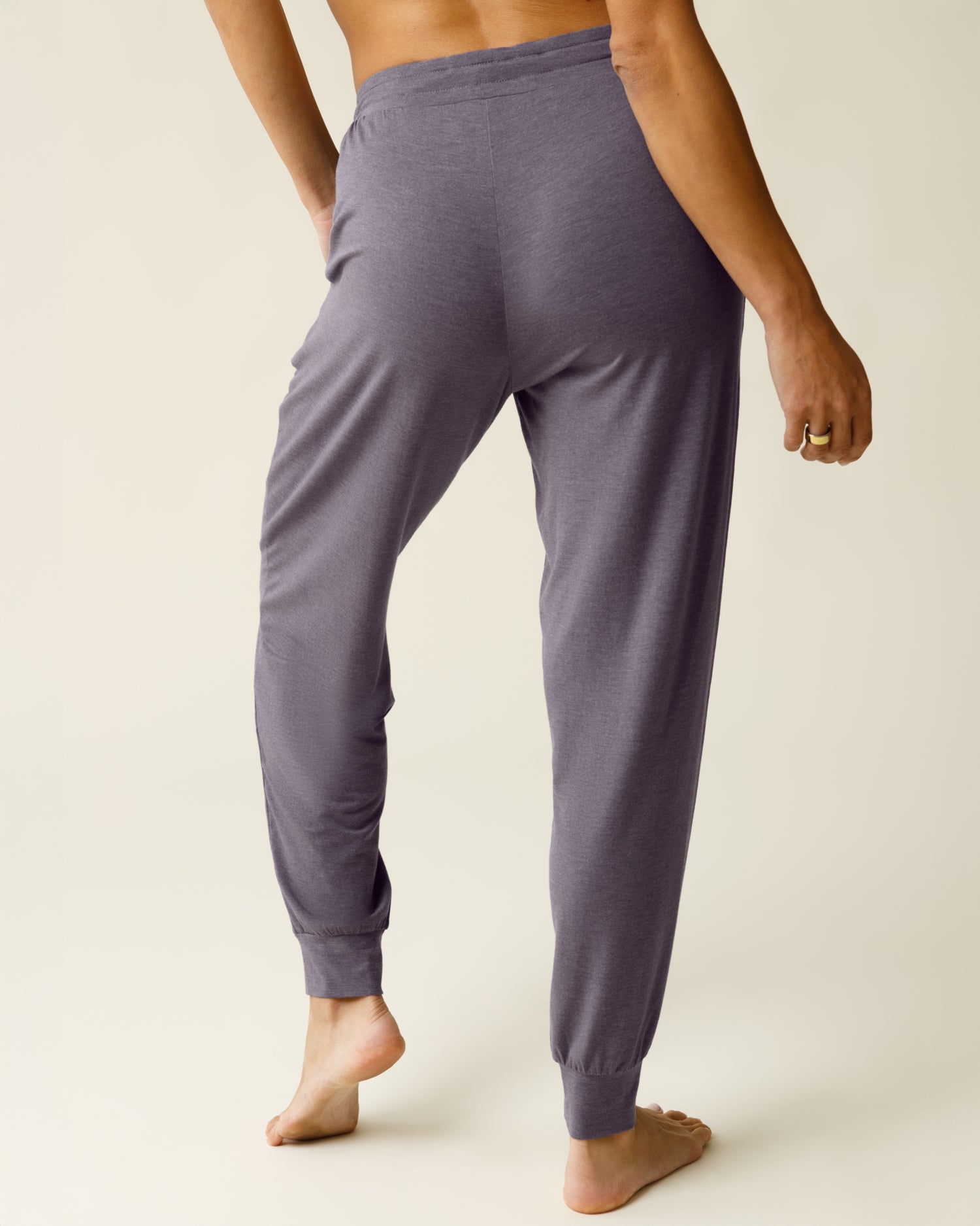 Woman wearing the Everyday Lounge Jogger in Heathered Granite, showing back