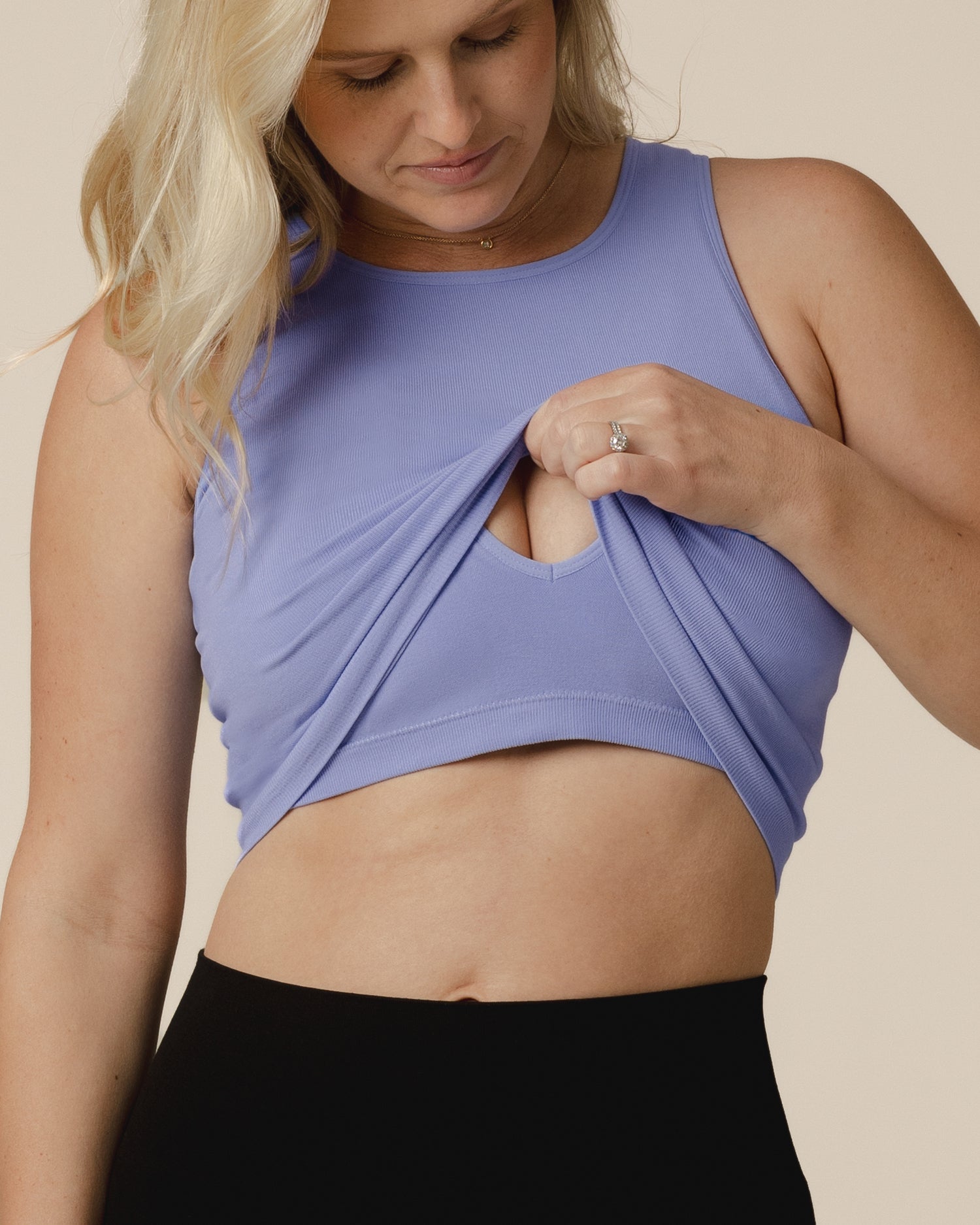 Model wearing the Sublime® Bamboo Maternity & Nursing Longline Bra Top in  in Blue Wisteria, pulling up outer layer to show nursing access