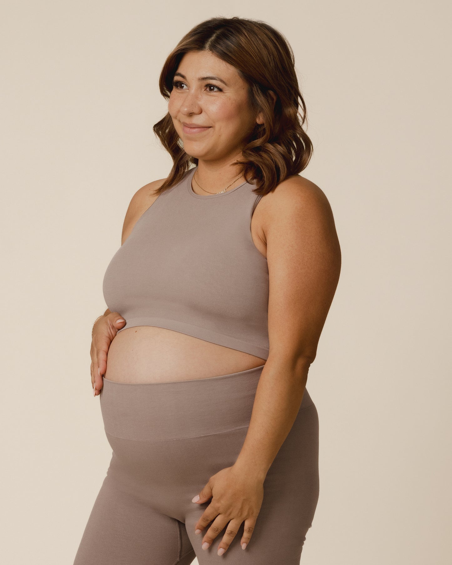Pregnant model wearing the Sublime® Bamboo Maternity & Nursing Longline Bra Top in Taupe, paired with matching Sublime® Bamboo Maternity & Postpartum Bike Short @model_info:Stephani is wearing a Medium Busty.