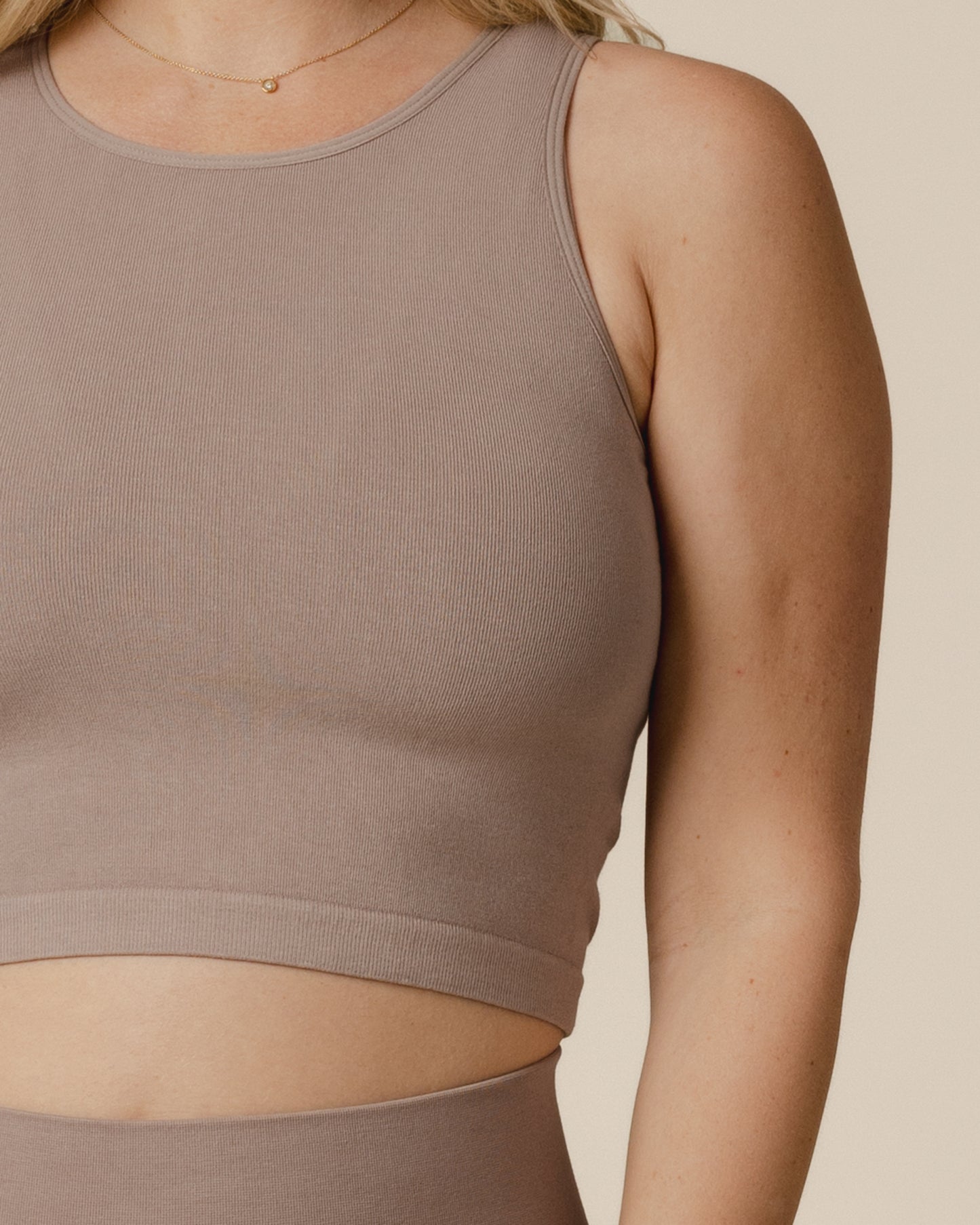 Closeup fabric detail image of model wearing the Sublime® Bamboo Hands-Free Pumping Longline Bra Top in Taupe