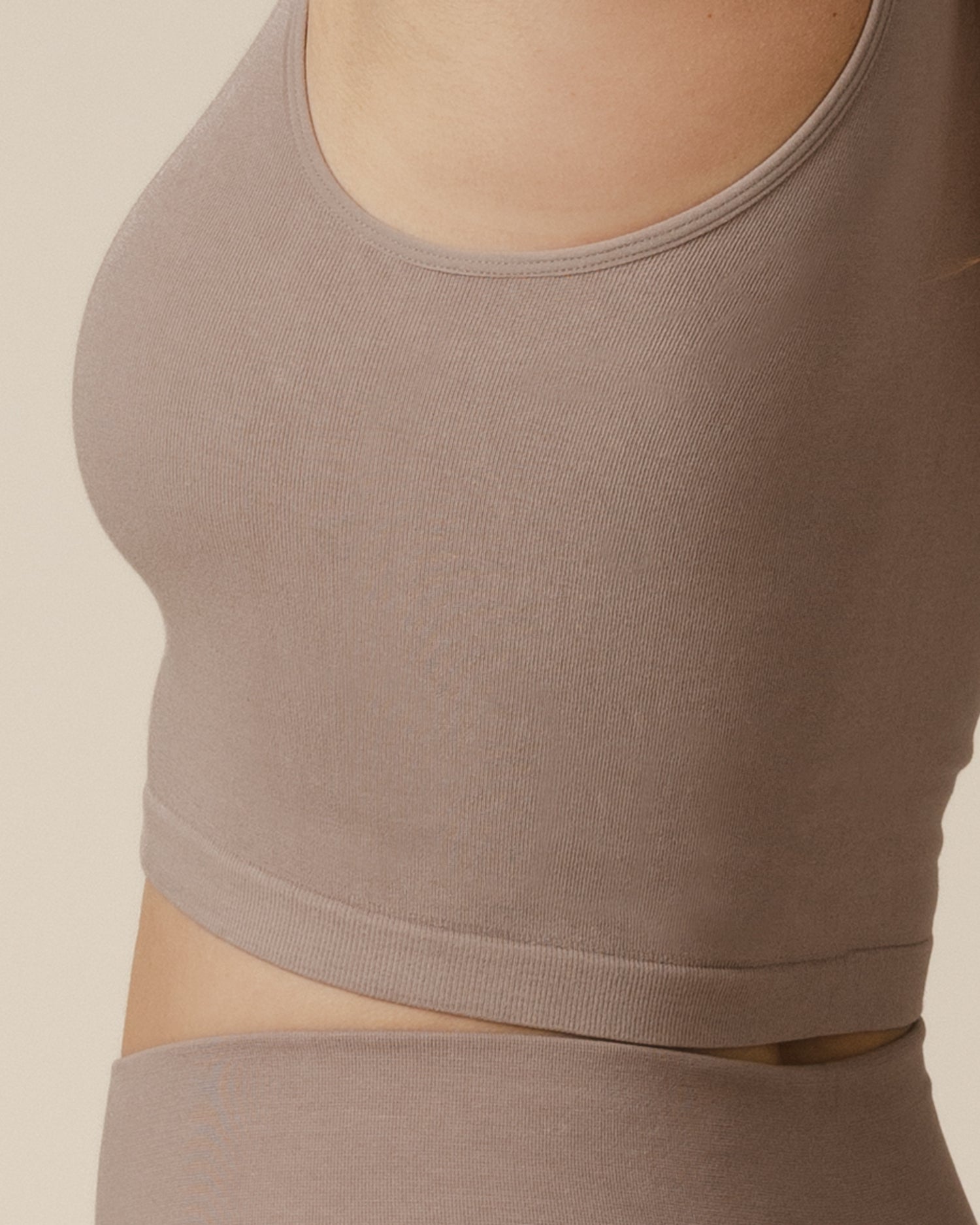 Cropped in side view of model wearing the Sublime® Bamboo Maternity & Nursing Longline Bra Top in Taupe, showing fabric detail