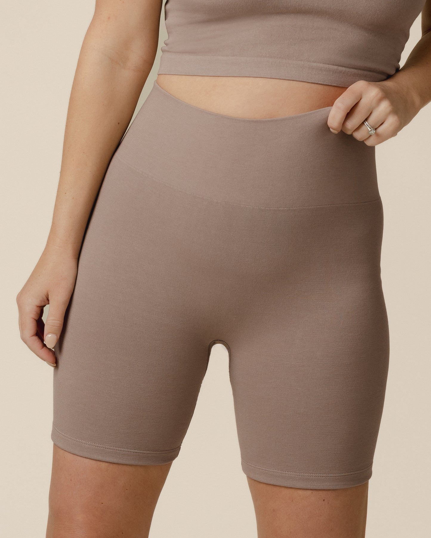 Front cropped in view of model wearing the Sublime® Bamboo Maternity & Postpartum Bike Short in Taupe