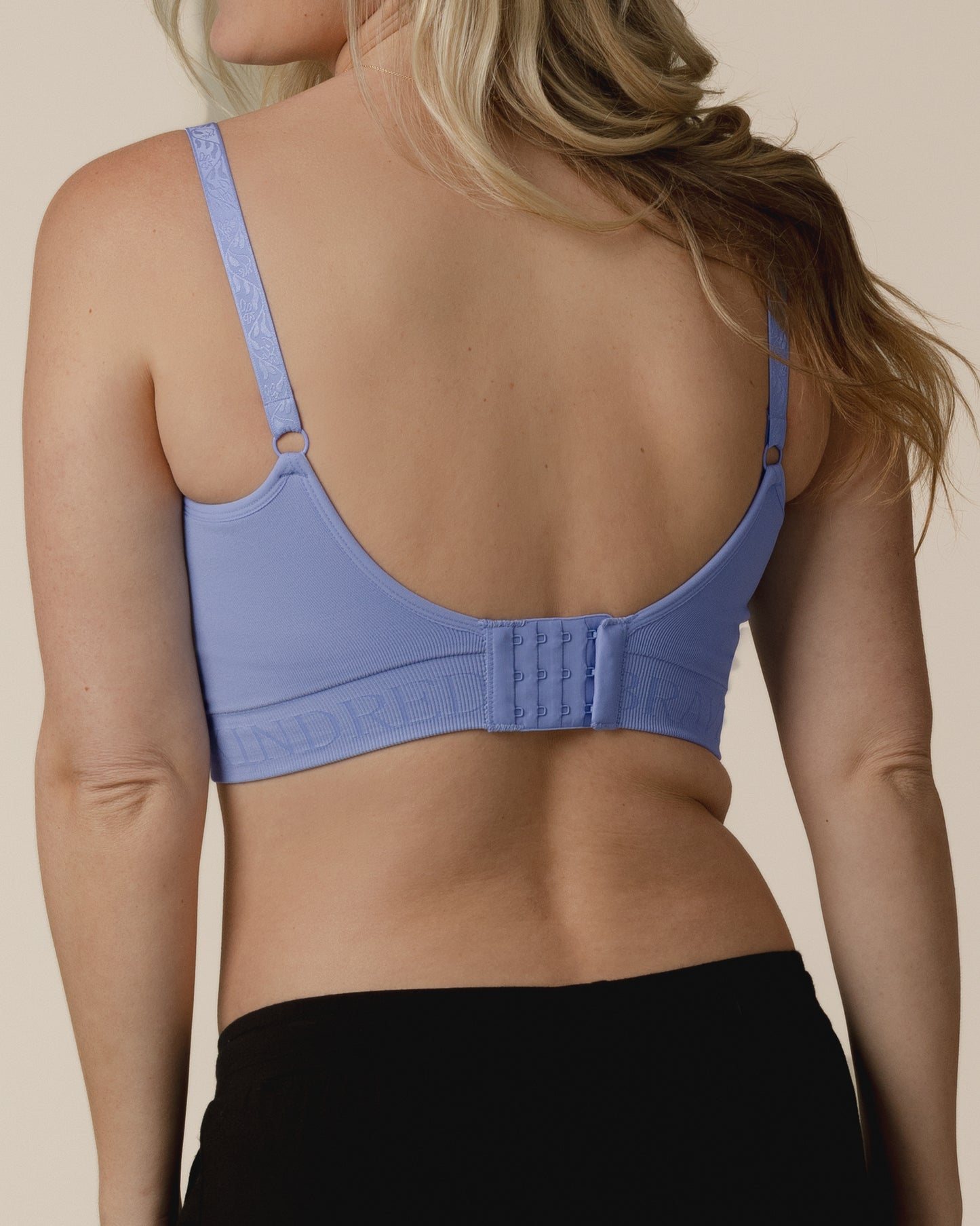 Back view of model wearing the Sublime® Hands-Free Pumping & Nursing Bra in Blue Wisteria