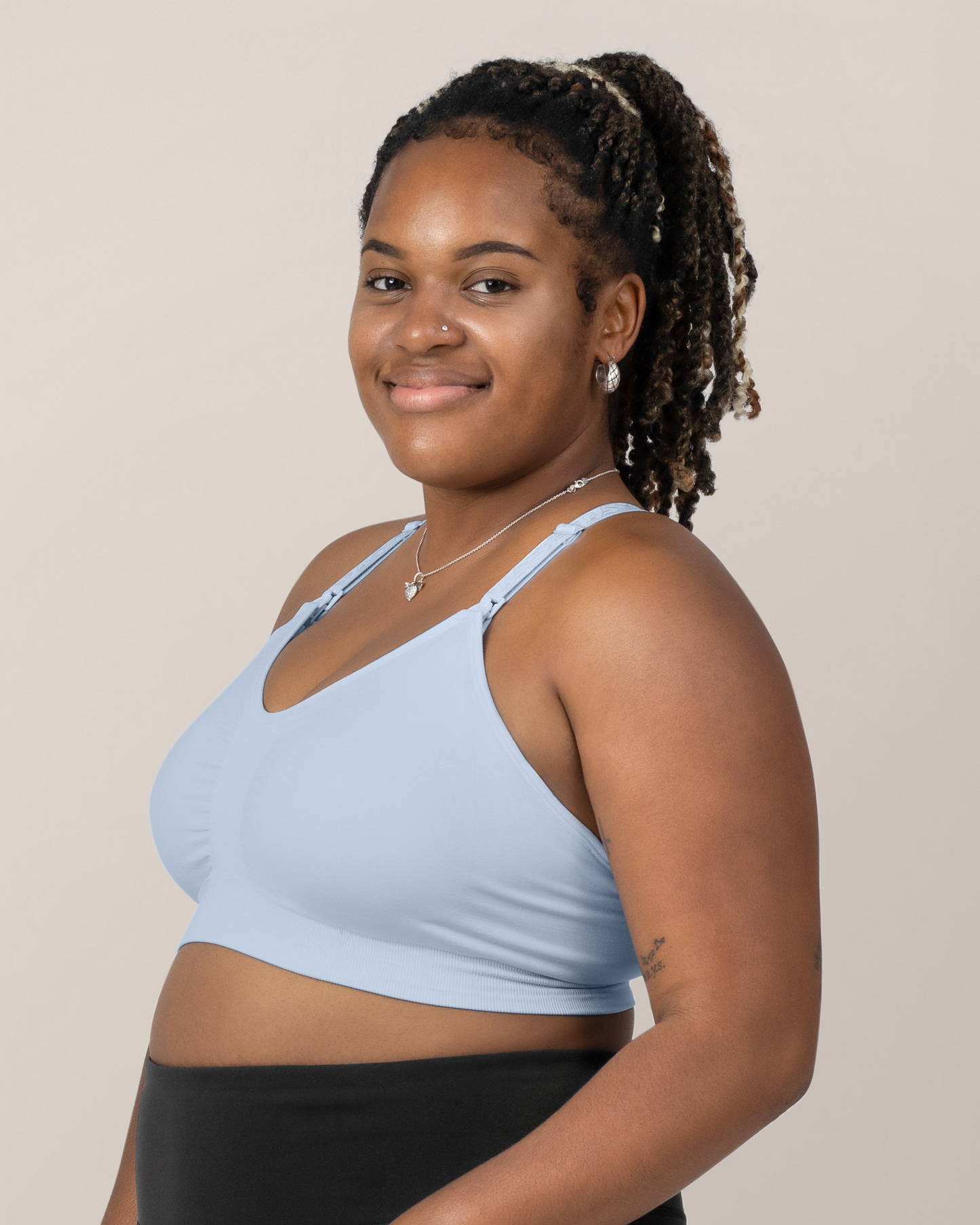Side view of Model wearing the Sublime® Hands-Free Pumping & Nursing Sports Bra in French Blue