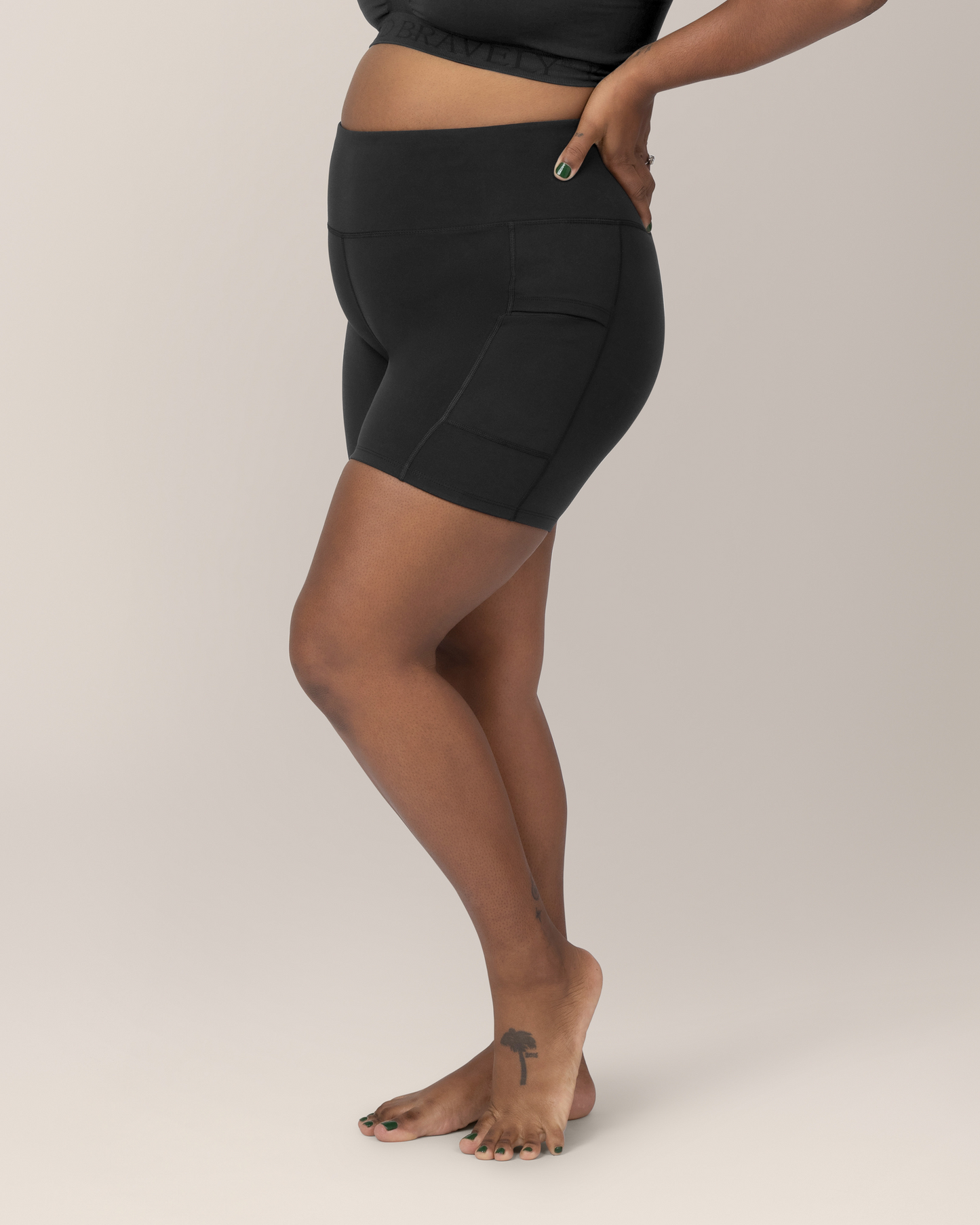 Side view of Model wearing the Stevie Active Postpartum Bike Short in Black