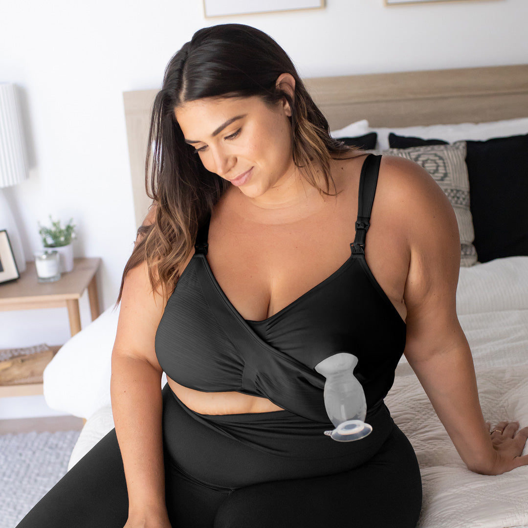 Busty model wearing the Sublime® Hands-Free Pumping & Nursing Bra - Super Busty in Black showing the easy clip down pumping access @model_info:Gia is wearing a 1X Super Busty.