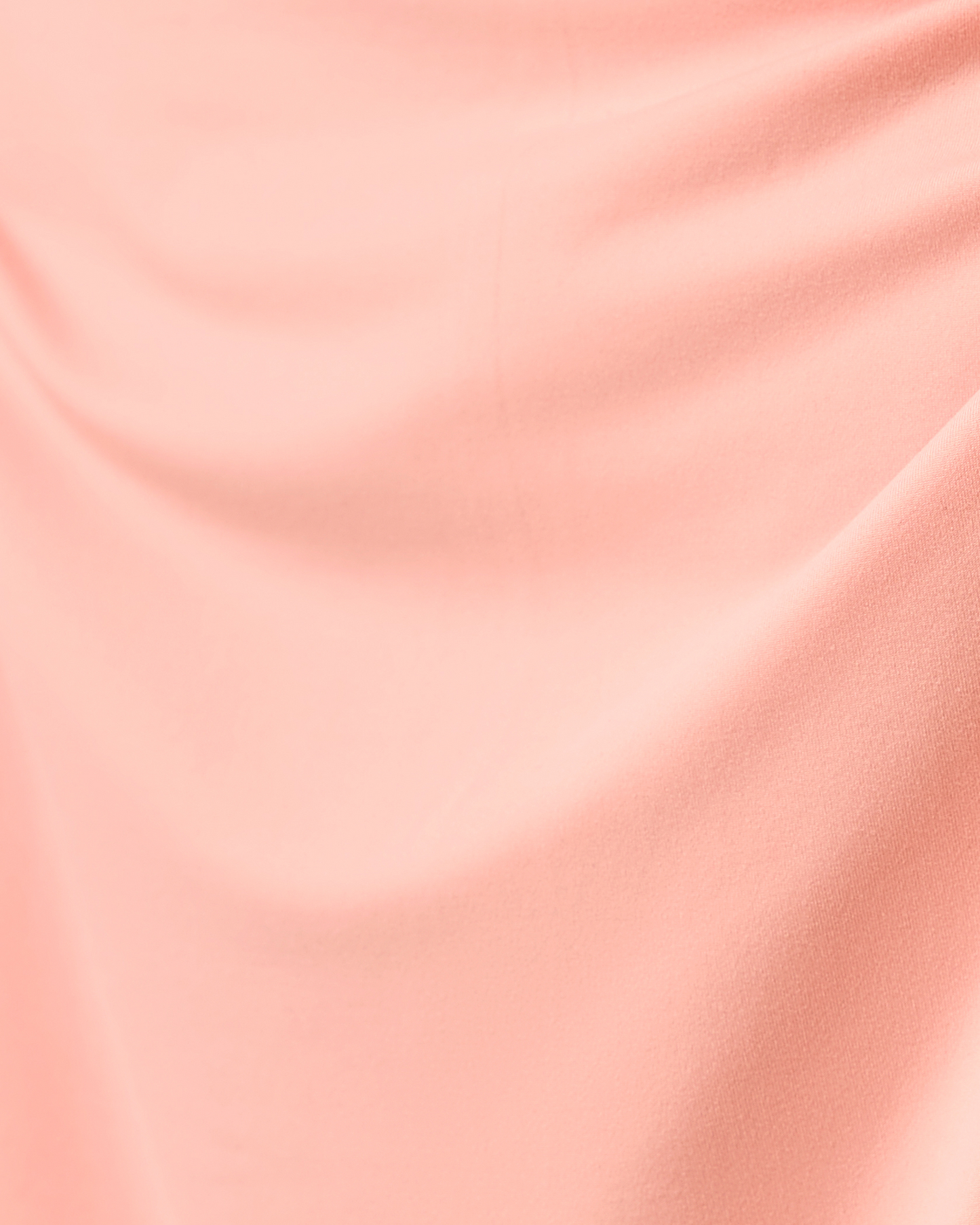 Close-up of pink fabric with a subtle texture