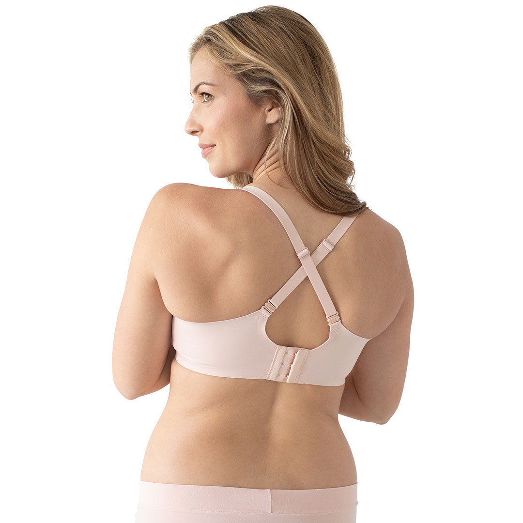 Back view of a model wearing the Ultra Comfort Smooth Classic Nursing Bra in Soft Pink.