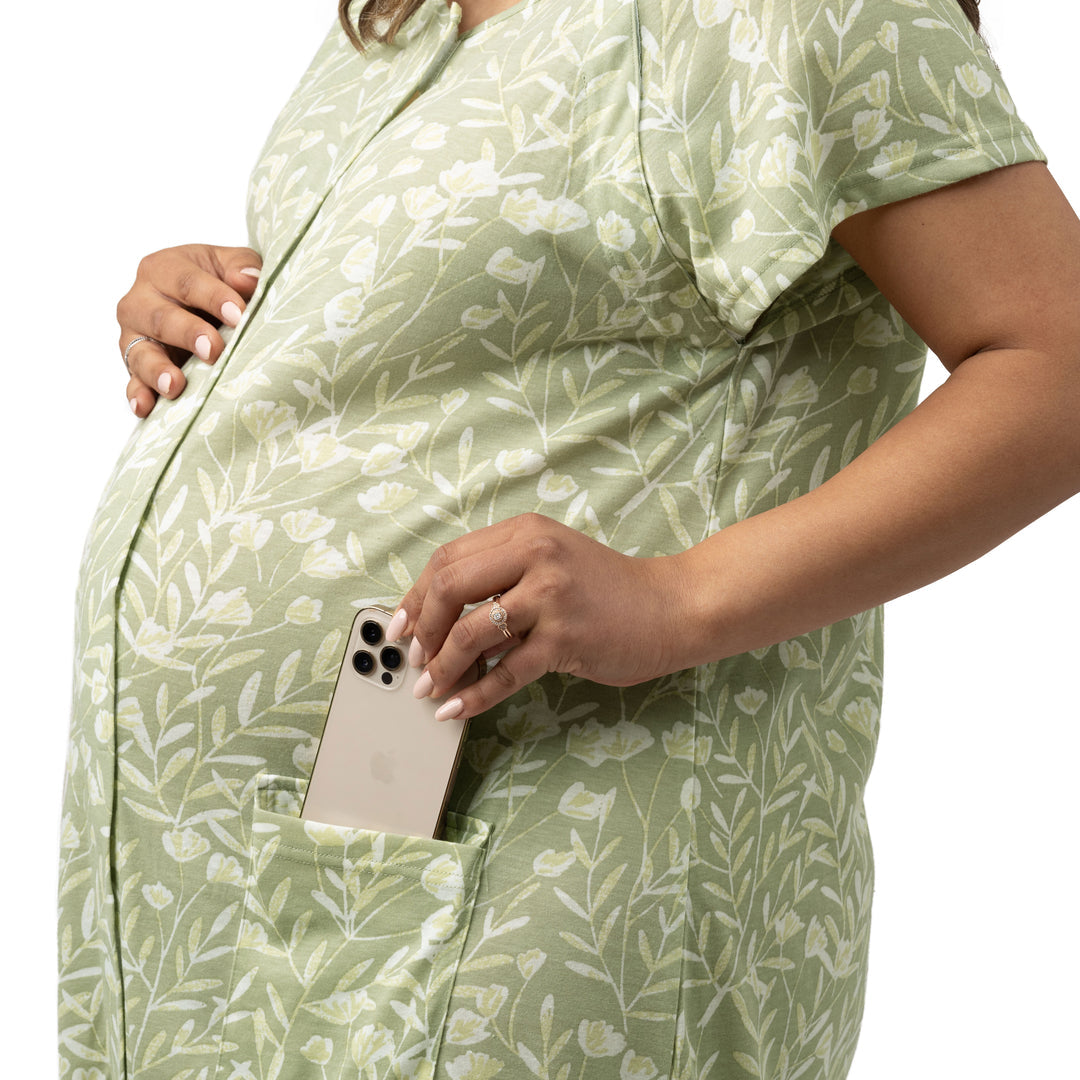 Closeup of a model wearing the Universal Labor & Delivery Gown in Fern with her phone in her pocket.